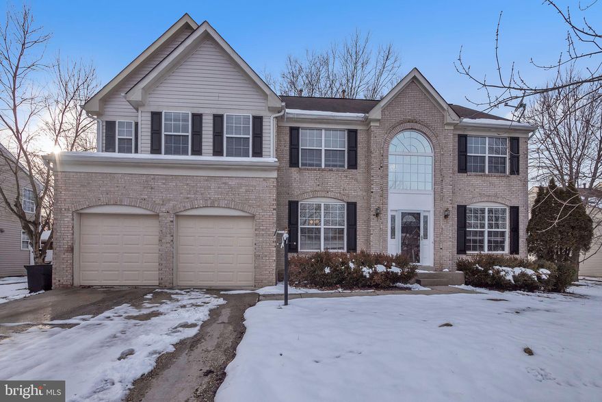 Welcome home to this beautiful 5 bedroom, 3.5 bathroom single family home with attached 2-car garage in Laurel! As you walk up to the home you will notice the elegant arched window above the door, adding a touch of sophistication to the home. Entering the home you will find a spacious foyer with gleaming LVP flooring that continues throughout the main level. To your right is a front sitting room, bathed in natural light from the large window - the ideal space for a quiet conversation or to enjoy a book. Across the foyer you will find the refined, formal dining room with chic chair railing and crown molding that creates the perfect atmosphere for hosting meals with friends and family. Make your way into the fully-equipped gourmet kitchen with ample countertop and cabinetry, including a prep island with extra storage and stylish pendant lighting. The kitchen connects seamlessly with the grand living room with cathedral-height ceilings, floor-to-ceiling stone mantle with gas fireplace and exquisite palladian windows that flood the room with natural light. This room provides the perfect gathering space to enjoy quality time with loved ones. Walking up the stairs to the upper level you can retreat into the primary bedroom suite with a large walk-in closet and a luxurious en-suite bathroom featuring dual sink vanity, soaking tub, and glass shower stall - the ideal place to unwind at the end of a long day! Three additional bedrooms, each with their own closet storage, and a full hall bathroom complete this level. Moving downstairs into the fully-finished lower level of the home you will find a spacious room that would work well as a family room or rec room. An additional separate room and full bathroom make this the perfect place to host guests or in-laws. This level also features its own kitchenette with refrigerator, dishwasher, sink, stove and oven - creating a great opportunity for a rental! This home is situated on a large lot that backs up to beautiful, mature woodlands. You can’t beat the location of this home, only minutes from multiple dining and shopping options as well as quick access to State Road 197 and the Baltimore-Washington Parkway. Don’t miss the opportunity to make this home your own, today!