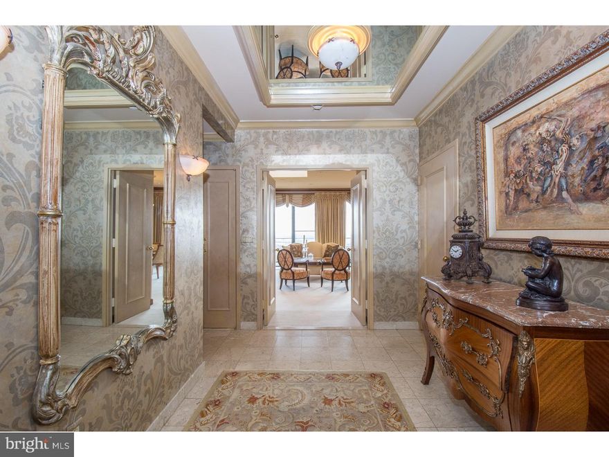 Wow! Imagine opening the door to your home located on the Penthouse floor of The Rittenhouse to be greeted by an unobstructed view from the balcony of Center City Philadelphia overlooking the square and spanning from the Ben Franklin Bridge to the sports center! Enjoy the brightness and beauty of this well designed home as you step into the marble foyer. This unique property on the 33rd floor features an open layout which includes the living and dining areas with a fireplace plus a full kitchen with bar area. On either side of this high-end designed unit is a bedroom, lovely bath and walk-in closets. A full laundry room completes the unit. There is a small storage unit in the garage.  Take part in any of the amenities the Rittenhouse Hotel has to offer.  Feel free to join the health club, dine in their restaurants, (or have dinner delivered to your unit). The condominium has 24/7 security.  $300 move-in fee and a $200 deposit for use of elevator.