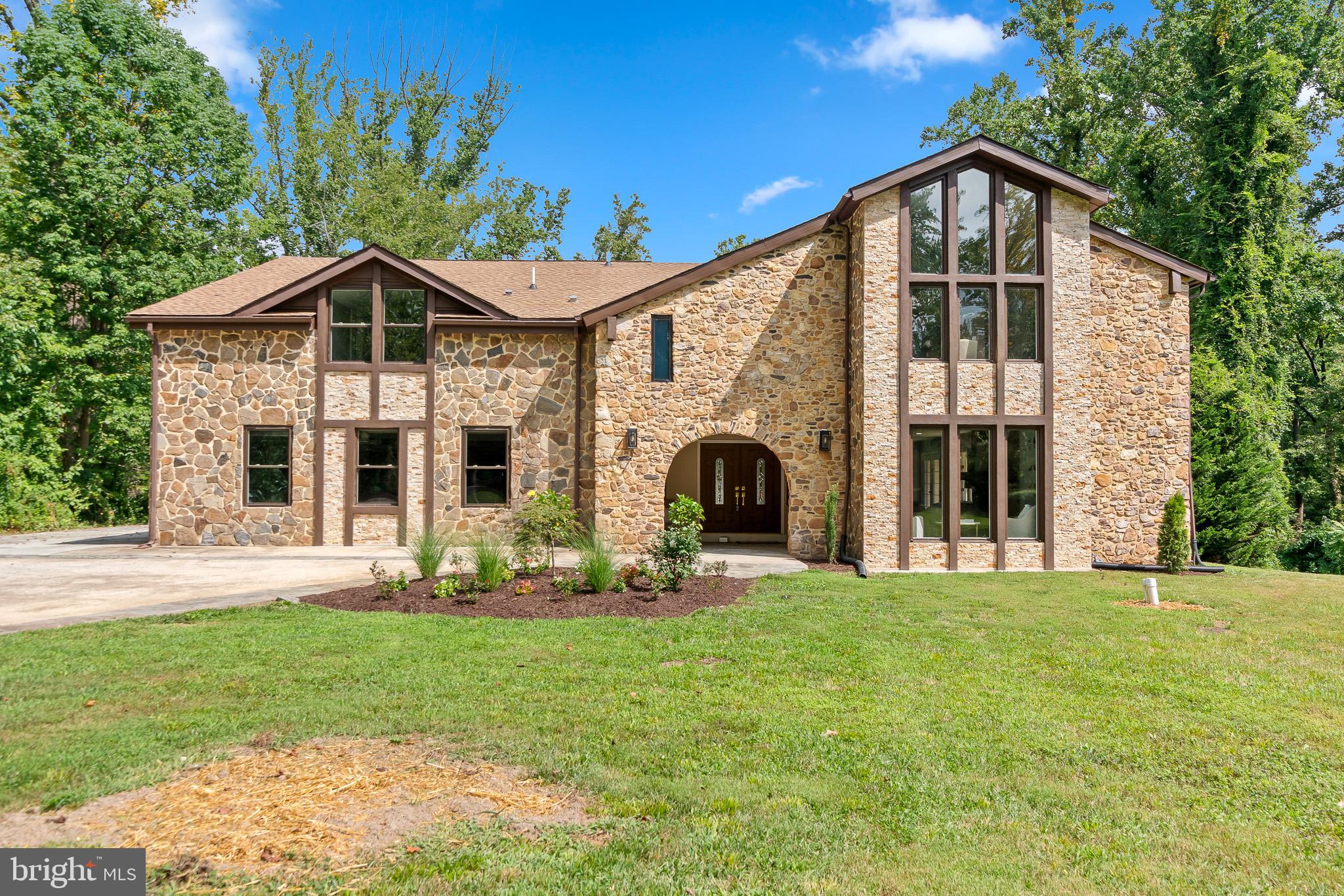 Exquisite 7,633 Sq. Ft. Stone Front Estate on Over an Acre with Water Access & Resort-Style Amenities
Wake up to the peaceful sounds of nature and end your day with breathtaking sunsets from your private balcony in this beautifully renovated 7,633 sq. ft., 6-bedroom, 5.5-bath stone front estate. Set on over an acre in the coveted Saefern neighborhood, this home perfectly blends elegance, comfort, and a one-of-a-kind waterfront lifestyle.
The grand foyer greets you with a sparkling chandelier and exquisite tile flooring, flowing into a gourmet kitchen with natural wood cabinetry, stainless steel appliances, a spacious island, and a cozy breakfast area with matching countertops. The open-concept family room invites connection and entertainment, while formal living and dining rooms showcase rich hardwood floors. Upstairs, cathedral ceilings crown the bedrooms, three with private en suites, including the primary suite with a spa-like bath and balcony views of the sunrise and sunset. A conveniently located upstairs laundry room makes everyday living effortless. Refinished hardwoods span the entire upper level.
The expansive finished basement offers a wet/dry bar and a versatile bonus room—ideal for a home theater, gym, or even a bowling alley. Outdoor living is just as impressive, with a large deck overlooking a picturesque backyard. The oversized 3-car garage and extended driveway provide parking for up to 11 vehicles.
Enjoy exclusive Saefern Saddle & Yacht Club amenities, including marina access with deep and shallow water slips, walking trails, horse stable, dog park, fishing pond, outdoor pool, and tennis and pickleball courts. Brand new roof and all electrical, plumbing, and HVAC work was fully permitted, with final inspections successfully passed for peace of mind. Surrounded by the serenity of nature yet minutes from the Severn River, downtown Annapolis, Annapolis Mall, Anne Arundel Medical Center, and Routes 50 & 97, this home offers the perfect balance of tranquility and convenience.
***Seller to install new double refrigerator, awaiting delivery***