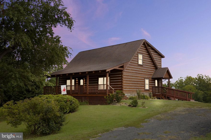 Beautiful cabin on over 12 acres with scenic views of the beautiful open yet backing to trees backyard, with a covered spacious front porch, a covered rear deck to enjoy the views, ramp to side door, main level primary suite, open vaulted ceilings in the family room leads to dining area with a bay window view of the back of the property, upstairs has 2 more bedrooms, a shared bathroom and an additional recreation area, office or workout space with more views of the back and overlooks the main level where the kitchen has all new appliances and just beyond there is laundry and an additional half bath. On the lower level you will find it is partially finished with the electrical work and drywall done. It is a full walk out with windows and just needs your finishing touches. There is an attached shed in the back of the home for storage along with a chicken coop that will convey. This sprawling 12.25 acres has a creek in the back of the property, trees and plenty of open area to continue farming which currently is about 6 acres being used.  Call for details!