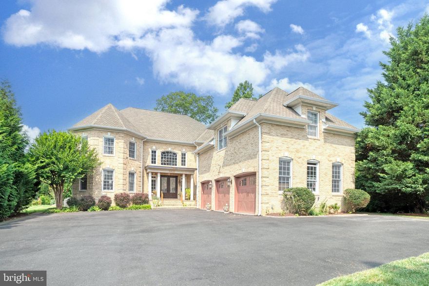 Beautiful custom built home on 1+ acre lot in Great Falls,  with over 10,000 luxuriously finished sqft of living and entertaining!  Grand, 2-story marble foyer with wrought iron railing. Gourmet chef's kitchen with 6-burner+ grill Viking cooktop, custom furniture grade cabinetry, granite counters and  island, with seperate  breakfast area. Fabulously appointed rooms with triple crown molding, wainscoting, custom paint, faux finishing  and over $75K of window treatments.  Main-level living with a bedroom and a full bath!! Brazillian cherry hardwood throughout plus special touches. Master suite is over 1500 sqft . Master bedroom with sitting room, wet bar, and 3 walk-in closets. Master bathroom with whirlpool tub, bidet, and oversized shower. Lower level has great recreation room, wet bar, theater,  gym! New Commercial Grade HotWater Heater cost over $8000. Three-car garage which allows for extra storage and plenty of driveway parking.  Sprinkling system upgraded to 38 zones using well water. Beautifully professionally landscaped and a great outdoor space for entertaining, close to shopping, dining, major commuter routes and hiking at Seneca Regional Park. 4 HVAC systems, Langley High School!!!