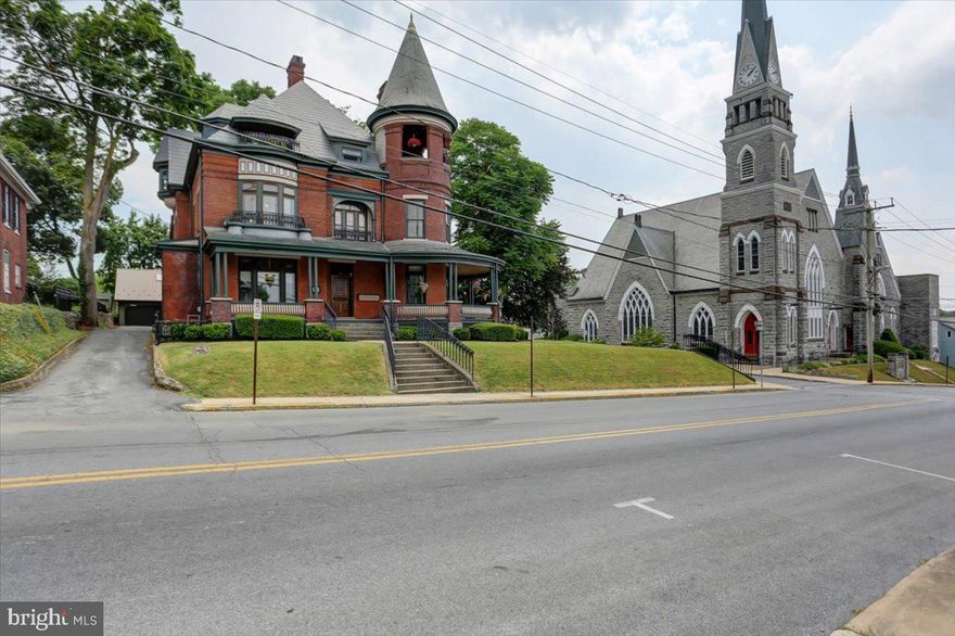 THE MAJESTIC HAWK MANSION. 
Welcome to The Majestic Hawk Mansion, a distinguished Victorian-era home circa 1893, situated at 100 East Orange Street in the charming town of Shippensburg, Pa.   An exquisite residence offers 8,554 sq ft of living space, meticulously designed and maintained, blending historic elegance and contemporary conveniences. 
ARCHITECTURAL ELEGANCE.  
This home features unique architectural elements, with exquisite woodwork highlighted throughout, including pocket doors, staircase, doors, and trim that showcase fine details and historic charm.  The original gas light fixtures have been converted to electric marrying the vintage aesthetics with modern convenience. Ten foot ceiling add to the grandeur of this home.  Metal shingle roof appears as slate. 
 GOURMET KITCHEN.  
The kitchen boasts granite countertops, a gas stove, 2 walk-in pantry areas and an operating dumbwaiter.  Perfect for culinary enthusiasts, this space offers both beauty and functionality.  Unique rotary wall phone.
UTILITIES.
Each living quarter/apartment has separate electric service.  Full house is metered for public water and sewer.  Home offers natural gas, steam radiator heating ensuring efficient and reliable warmth. 
REGAL TOUCHES.  
Turrets on each floor add a regal touch, with the third-floor turret serving as a balcony.  The mansion includes six spacious bedrooms, two on each floor, and a total of 4.5 baths, making it ideal for those who enjoy ample space. 
HISTORIC FEATURES.  
Seven fireplaces, beautiful intricate stained glass windows, and timeless hardwood floors add character through this masterpiece.  Wrap-around composite porches, balconies, and gazebo provide serene views for outdoor relaxation or entertaining. 
EXPANSIVE LOT AND GARAGE. 
 The .56 acre corner lot is meticulously maintained, featuring a 21x36 detached four-car garage with a full 2nd floor for storage or additional space to finish off.  Vegetable garden and grape arbor is located behind the garage.  Rear alley access with additional parking space if the garden isn't desirable.   
VERSATILE ZONING.  R2 Residential Medium Density Zoning offers flexibility for the future owners, suitable for a variety of residential uses, such as a bed and breakfast, group home, rental units, home business and more! The second and third floor currently house rental apartments, perfect for rental income or guests. The second floor features two one-bedroom units each with a kitchen, living room, full bath, dining room and spacious bedroom.  The third floor, currently tenant-occupied, offers two bedrooms, kitchen, laundry, living room, den and full bath.
INVESTMENT POTENTIAL. 
This property is a rare find with significant rental potential, adding to its appeal.  Whether you are looking for a grand home, an investment property or a combination of both, The Majestic Hawk Mansion is a magnificent choice. Schedule a showing today and experience the grandeur and elegance of this exceptional home for yourself.  Qualified buyers only