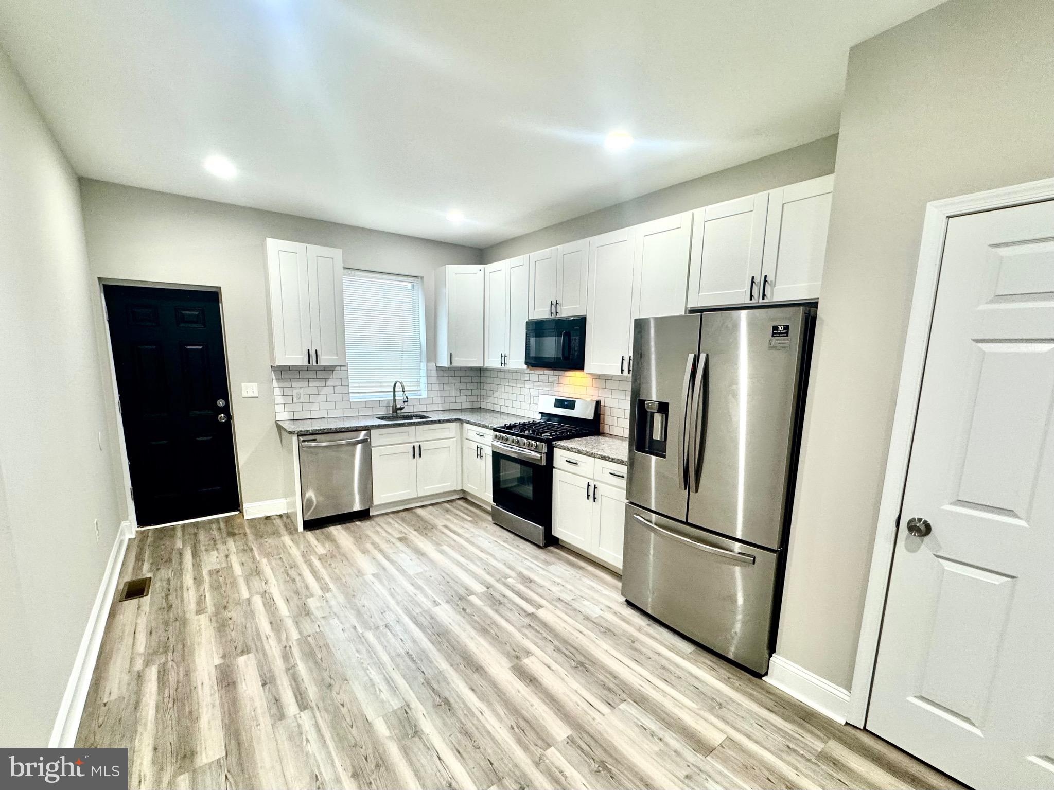 Welcome to 2340 W Fayette St, a stunning fully renovated end-of-row townhouse offering modern comfort and style! This move-in-ready home features 2 spacious bedrooms and 1 full bathroom, designed for both functionality and elegance. The beautifully upgraded kitchen boasts granite countertops, a brand-new Samsung refrigerator, a new dishwasher, and a microwave, perfect for culinary enthusiasts. Convenience is key with an in-unit washer and dryer on the second floor. Step outside to enjoy the private rear deck, ideal for relaxing or entertaining. Plus, the basement with a private entrance offers additional space and flexibility. Don’t miss this incredible opportunity—schedule your showing today!