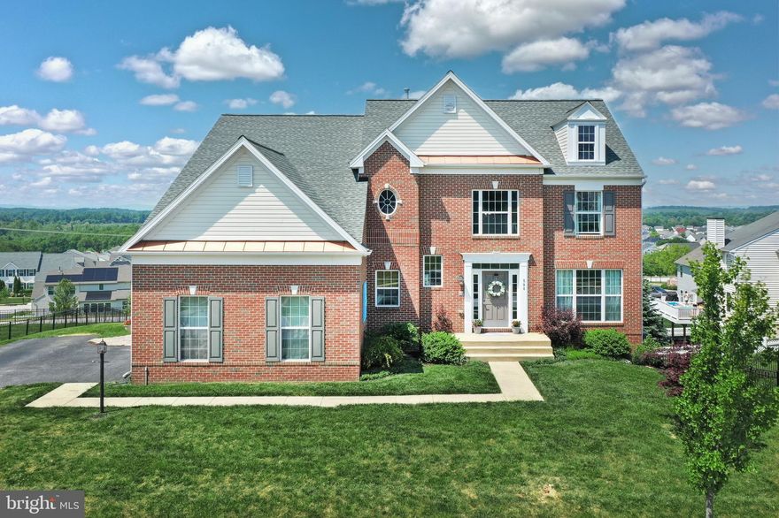 Looking for Executive Living with a Great View?   This amazing view comes with a remarkable executive style 2 story home.  Located on a Cul-De-Sac in Dallastown School District one mile from the Loganville Exit of I-83, making it an easy commute to York or MD.  This property is also convenient to Lake Redman, Nixon Park,  as well as  other county parks.  The sought after Logan's Reserve Community offers a community swimming pool, club house, playground, putting green,  gym, basketball court, and walking trails.   Entering the home you will be greeted by a 2 story Foyer with wood floor and coat closet.  Large Living Room with hardwood and columns leading to the Dining Room with wood floor. Both rooms feature crown molding and chair railing. The Gourmet  Kitchen offers Corian Countertops, Ceramic Tile back splash, Wood cabinets, All Stainless Steel Appliances, Double Oven, Copper farm sink, recipe  desk, walk in pantry closet, large Island, and a 10- long breakfast bar looking into the Breakfast room with wood floors, vaulted ceiling, a circle top window, and transom windows.  From the kitchen you have a great view of the family room and gas log fireplace. On the first floor you will also find a half bath, mud room with LG washer and dryer, and an office / possible 5th bedroom.   Ascending to the 2nd floor you will be greeted by an oversized primary bedroom with vaulted ceilings, circle top window, his and her walk in closets, and a sunken  9X 19 sitting room. The Luxury Bath off the primary bedroom offers ceramic tile flooring, a ceramic tile shower with an upgraded glass door and marble seating, double vanities, jacuzzi tub, heat lamps and a linen closet.   Also on the 2nd floor you will find the other three bedrooms to be very accommodating.  and not one, but TWO hall full bathrooms. Both with ceramic tub surrounds.  Other features include: 9' ceilings on the first floor,  Two heating and cooling systems, 74 gallon hot water heater, walk out basement with bathroom rough in, Dual Nest Thermostats,  Central Vac, Garage Guys wall organization system in the garage, 2 new insulated garage doors, Security system, Intercom system with surround sound system.  You may enjoy the view from the 800+/- sqft composite deck with PVC railing and sconce lighting.  This is a one of a kind home in a one of a kind community.