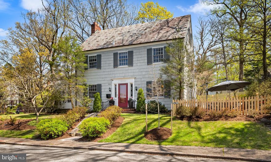 OPEN HOUSE SATURDAY APRIL 18th 12PM to 2PM! Original details combine with thoughtful renovations throughout this 5BR/2.5BA character-laden cedar-shingle Center Hall Colonial on a corner lot  in idyllic and convenient historic Homeland, around the corner from the Homeland Lakes. Classic Foyer entry, custom replacement wood windows, beautiful original inlaid wood floors, hall Powder Room and Mudroom, spacious Living Room with wood-burning Fireplace and double French doors leading to Sunroom Den for a cozy retreat year-round. The formal Dining Room includes a built-in corner cabinet and connects to the eat-in Gourmet Kitchen with banquette, built-ins and island. Five spacious bedrooms in all, including a Primary Suite with renovated Primary Bathroom. Plus, a Lower Level Family Room, detached garage, expansive stone patio perfect for entertaining, and a much loved play yard, with a new wooden picket fence. All within walking distance to local schools, shops, restaurants and a quick commute to Penn Station, downtown, Towson, I-83 and 695.  Welcome home!
