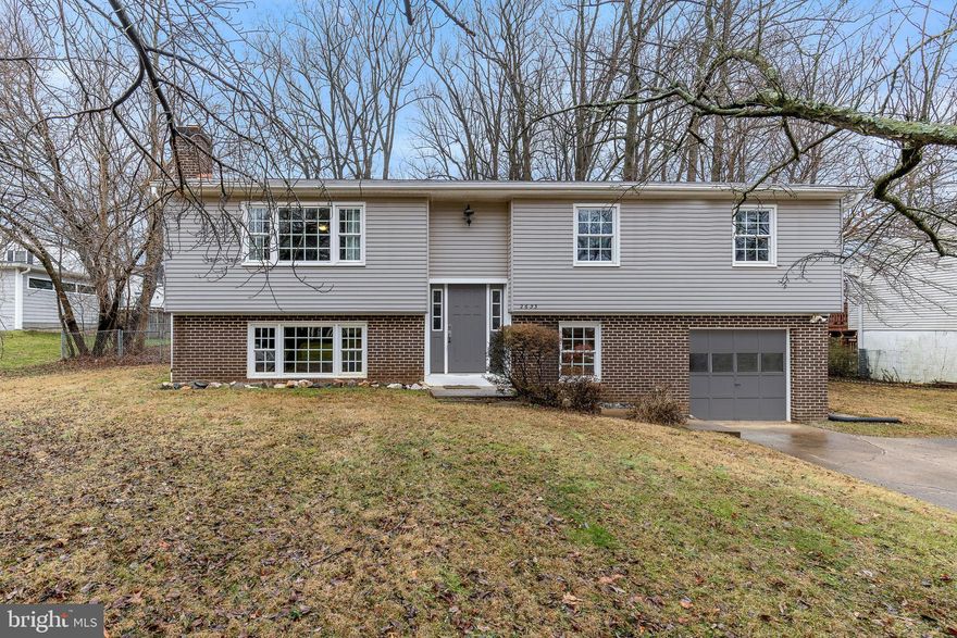 West Falls Church Convenience with updates and charm!  This light-filled, two-level split-foyer is sited on a huge lot just minutes to Mosaic District, Falls Church City, Tysons Corner, and West Falls Church Metro! The home boasts hardwoods on the main level, and large windows throughout. Updated kitchen with stainless steel appliances and skylight. Picture window in spacious living room floods the space with natural light. Double French doors in the separate dining room lead to a spacious deck and the private, flat, fenced backyard.  3 bedrooms and 2 full baths — including an en suite primary — complete the main level.  This home's lower level features an oversized family room with a cozy wood-burning fireplace, offering ample space for relaxation, gaming, and more.  The lower level also features a 4th bedroom, a full bath, and a laundry room.  Park effortlessly in the attached 1-car garage or your private driveway. The almost half-acre lot includes mature trees and a fully fenced flat backyard.  Excellent location, just minutes to commuter routes (66/495/7), West Falls Church Metro, Tysons, Mosaic, and an array of shops and restaurants.
Don't miss this fantastic opportunity to reside in the heart of Falls Church!
