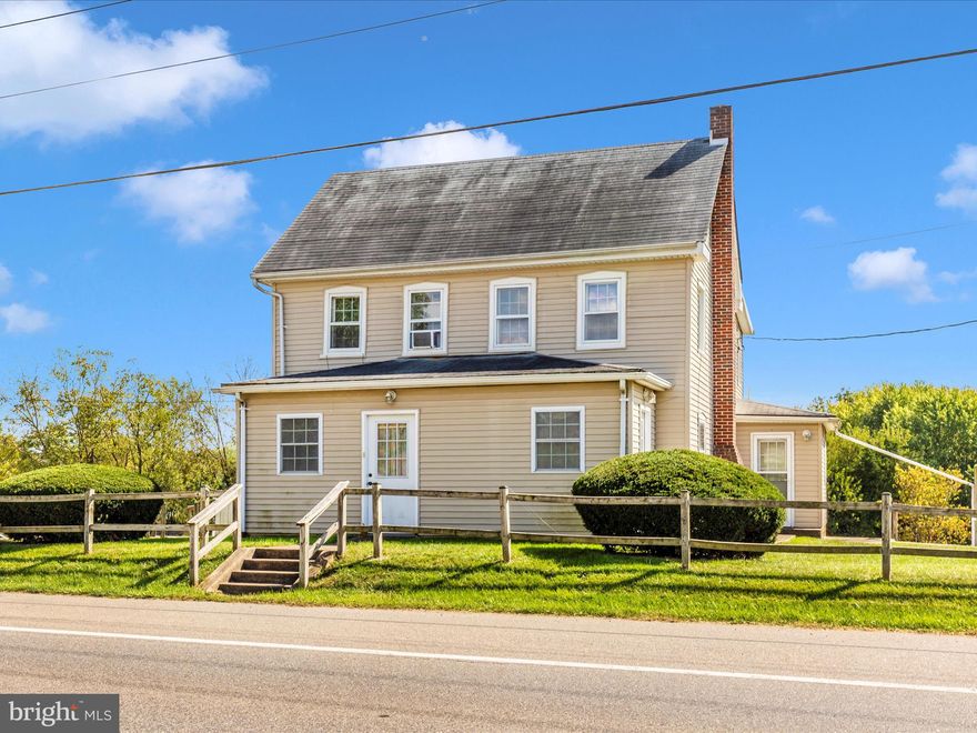 Discover the perfect balance of history and convenience in this 1878 sq. ft. farmhouse, set on a spacious .75-acre lot.  Built in 1859, the home retains its timeless character with original details like wood-slat farmhouse doors, while offering smart updates to give peace of mind to today's buyer. 

Major Updates Include:
* Roof replaced in 2017
* Windows updated & wrapped for efficiency
* Electrical system upgraded in 2006
* Front & side porches enclosed (2006) permitted and inspected
* Laundry relocated to main level
* Well & Septic installed 

 Step inside to discover a warm and inviting interior, highlighted by solid hardwood flooring and a traditional, circular floor plan that seamlessly connects the dining area, living room, den and kitchen. The home boasts four spacious bedrooms with one full bathroom and an additional half bath.  The kitchen and bathrooms are in good condition, ready for your cosmetic updates to reflect modern style.  

Outside, enjoy your morning coffee off the back deck, or simply unwind while enjoying the natural surroundings.  The level backyard, backing to trees, offers ample outdoor space for recreation, expansion, or entertaining.  Multiple outbuildings offer versatile storage solutions or potential workshop space. Parking is hassle-free with off-street options available.    

This farmhouse is move-in ready, with all the major systems already addressed--leaving you free to add your own style and vision.  A rare opportunity to own a well-maintained historic home that offers excellent potential for value growth with light renovations.  A smart investment for anyone seeking a mix of history, space, and opportunity.