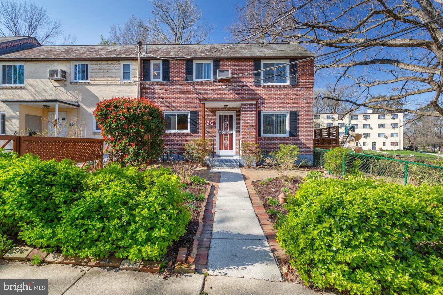 This stately 3 bedroom brick GHI home checks off every box for the most discerning buyer. Located a block from the town center and adjacent to open park space! The interior has hardwood flooring throughout the main living areas and new tile flooring in the kitchen. The kitchen has gorgeous quartz counter tops, custom hardware, newer stainless steel appliances, a brand new refrigerator, new washer and scenic bay window! A first floor remodeled half bath and extensive built in book shelves with accent lighting round out the main level. The mini- split heating and cooling system was installed in 2024. The outdoor space is one that makes passersby stop to admire. A screened porch, patio with retractable awning, private deck and fenced yard make this home an entertainer's dream! Buy now and you'll be moving in just in time to have a front row seat for the Greenbelt Labor Day Festival without moving your car! The monthly coop fee includes the property taxes!