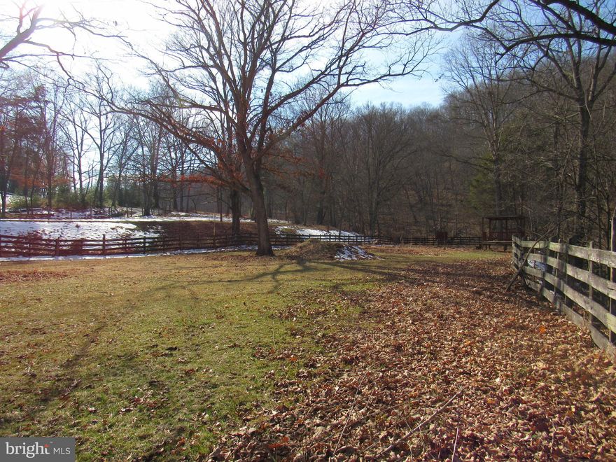 Peaceful 1.89 Ac. off of paved road near the new Lost River State Park mountain bike trail.   Lot comes with well, septic and electric already on site.  Stream on back side of property.  Not in a subdivision.  GIS shows a trailer on property but it has been moved.  Current owner using non deeded right of way for access, new owner will need to install driveway.