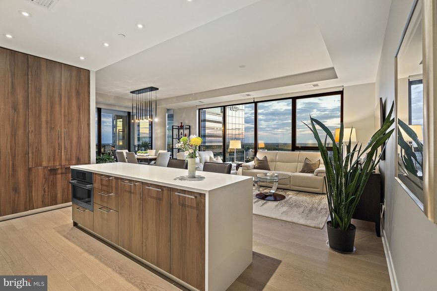 Experience luxury living in this 1,778 square foot 2-bedroom, 2.5-bath, with a Den! Complete with Italian cabinetry, under cabinet lighting, and Bosch appliances, this kitchen is perfect for quiet cooking nights in. Otherwise, one block away will take you to the heart of Tysons, outfitted with an array of restaurants like Circa, Flower Child, North Italia and Poki DC!

Retreat into the comfort of the primary bedroom fitted with recessed lighting and tray ceiling. Ample space is provided in a custom walk-in closet!  Luxury abounds in the primary bathroom which boasts porcelain Calacatta marbleized flooring and surrounds. It also is finished with a custom 2 sink Italian vanity and a frameless walk-in glass shower with bench.

A versatile second bedroom features a murphy bed and en suite full bath. Need more space? This unit also has a den, allowing additional recreational or office space. Two prime parking spaces and a large storage unit provide all the convenience you need.

The Verse Condominium boasts luxe amenities including a stunning lobby, grand entertainment lounge with gourmet kitchen, high performance fitness studio and a one acre sky park with both exclusive to The Verse and shared space with the neighboring Borden  Other amenities include: an outdoor pool with chaise lounges and panoramic park views, secure bicycle storage with repair station, Pet spa (bathing tub, grooming table and blow dryer), guest suite with hotel amenities, secure resident-only garage. The 25th floor offers a breathtaking view from the rooftop balcony. Professional on-site concierge ensures top-notch service and a seamlessly run community.
 
The monthly condo fee covers all utilities except electricity and cable/internet, providing hassle-free living. Beyond the building, explore the vibrant surroundings of The Boro, featuring Whole Foods, Starbucks, ShowPlace ICON Theatre; an array of restaurants, shops and services. Elevate your lifestyle with this condo's exceptional layout and an array of amenities that make every day a luxury living experience. Schedule a viewing today to experience the perfect blend of sophistication and convenience!