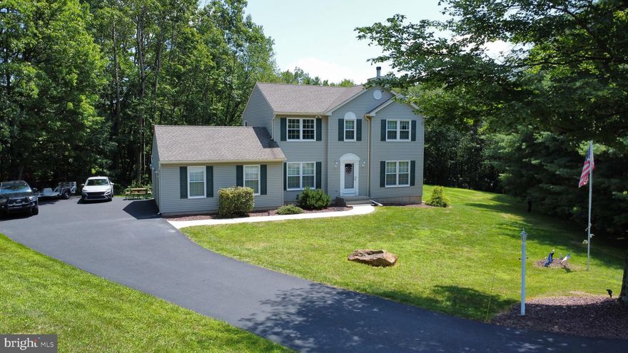 Enjoy your privacy at the end of the cul de sac in this 3 bedroom, 2.5 bath colonial. Nestled neatly on a partially wooded lot yet still plenty of sunshine throughout the day. Eat in kitchen with center island, stainless steel appliances, pantry with easy access to the deck. The comfortable family room has a brick wood burning fireplace. The living room has a propane stove for extra warmth. Separate dining room adds more 1st floor living space. The primary bedroom contains a large walk-in closet, private bath with a corner jetted tub and separate shower. Two more spacious bedrooms share the common bath. The basement walks out to the yard and is ready to finish. It contains laundry, acid neutralizer and another propane stove. The raised deck overlooks the yard and woods for outdoor entertaining. Both 100 gallon propane tanks are owned. Roof replaced in 2019, windows replaced 2017 & 2022. 22x22 two car garage and plenty of parking in the driveway. Great location close to shopping, entertainment, Blue Mountain and exercise trails. This one will go fast so come see it soon!