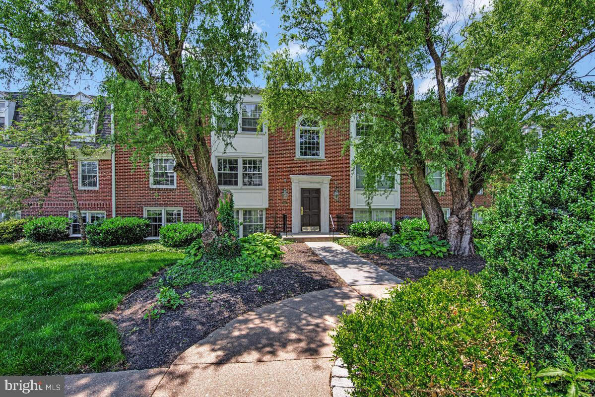 Welcome to this wooded, expertly landscaped condominium community where a breathtaking condo that promises luxury and convenience awaits you. This condominium has been meticulously designed to offer an unmatched living experience in a highly desirable, gated community. This beautifully renovated condominium with fresh paint and new luxury vinyl flooring (with extra padding) is ready for owner or tenant-occupied living. Step into a spacious main living area where natural light floods through large windows (all windows are replacement windows). Enjoy an open floorplan with the seamless flow between the dining room and living room, complemented by elegant crown molding. The recently updated kitchen is a culinary enthusiast's delight, featuring granite countertops, granite extended backsplashes, granite breakfast bar, crown molding, a feature wall panels, new window treatments and updated with stellar appliances (stainless steel and black) including a Bosch gas range stove, Bosch dishwasher, and brand new over-the-range microwave and refrigerator. The kitchen also boasts new lighting, ceramic tile, and a built-in shelving unit perfect for flowers, plants and/or kitchen essentials. The primary bedroom offers two very large closets, several windows, and a complete master bathroom suite with a 100% granite-walled shower. An additional well-trimmed bedroom and full bath complete this gorgeous home. The hall full bathroom is complete with new subway tile, re-glazed tub/shower and new plumbing accessories and light fixtures. For your convenience, a washer and dryer and storage unit are located less than 10’ from this condo’s entry door. Living in the Villages at Homeland means enjoying access to exclusive amenities such as a large community pool, a well-equipped fitness center, and complimentary electric vehicle charging stations. Utilities like natural gas and water are included in the condo fee, adding to the worry-free lifestyle this home offers. Located near prestigious universities such as Morgan State, Notre Dame of Maryland, Loyola, and the University of Maryland, as well as close to the Maryland Workforce Technology Center, dining, and shopping—everything you need is within easy reach. Consider scheduling your showing today and experience luxury living at its finest!