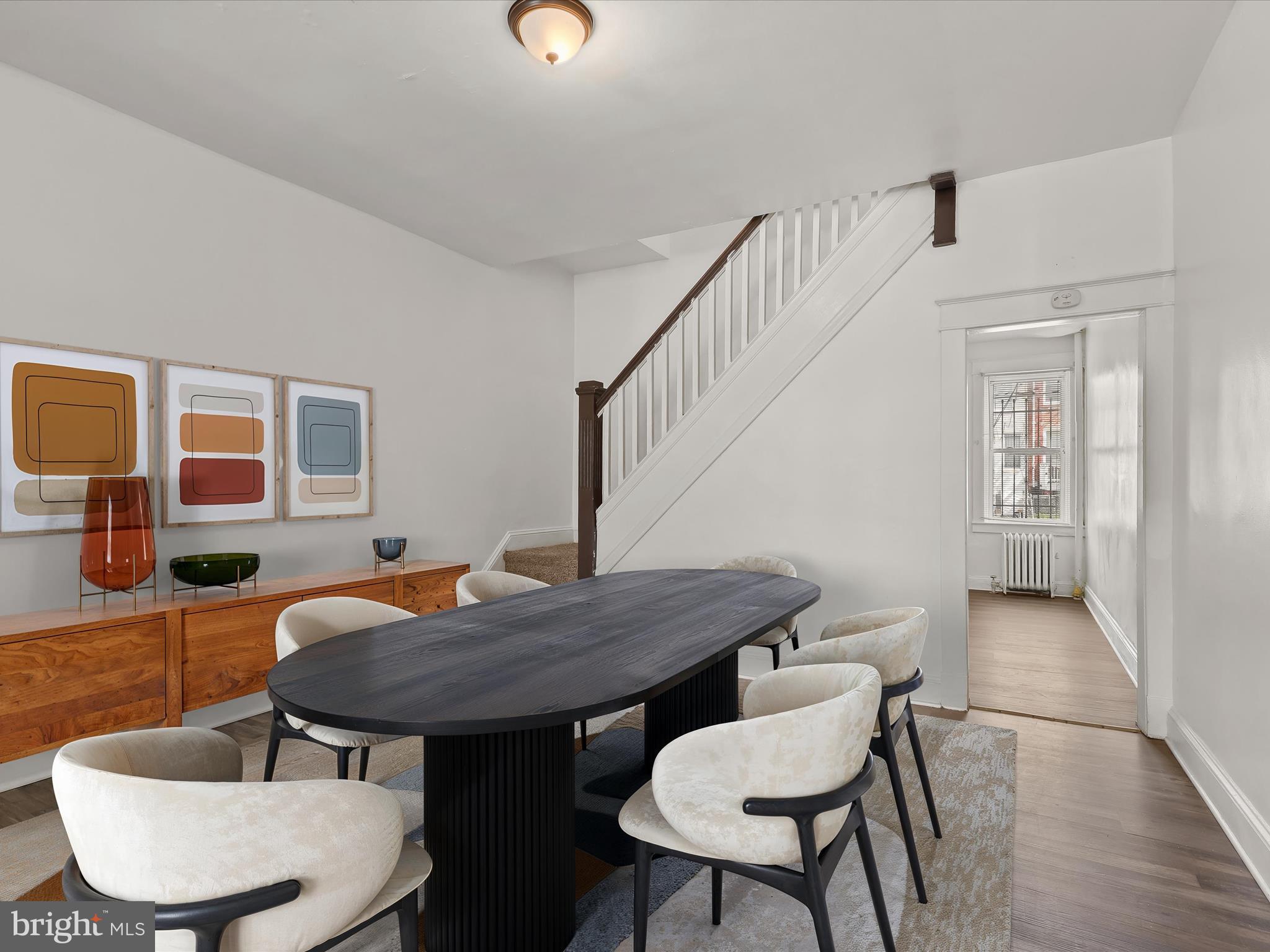 >> TURN KEY EQUITY<< Brimming With Charm, This Home Offers Over 1,500 Square Feet Of Inviting Space - NO HOA - Ready For Immediate Move-in And Turn-key Equity. Large Windows Fill The Space With Natural Light, While Elegant Window And Door Moldings Add Timeless Detail. The Living And Dining Areas Offer A Functional Layout With Defined Yet Open Spaces—ideal For Everyday Living And Entertaining. The Spacious Kitchen Features White Cabinetry, Ample Room For Casual Dining Or A Breakfast Nook, And Access To The Backyard For Easy Indoor-outdoor Flow (Potential Off Street Parking). A Bonus Room Off The Kitchen Provides Flexible Space For A Pantry, Home Office, Or Mudroom—whatever Suits Your Lifestyle. Upstairs, Three Generously Sized Bedrooms Provide A Restful Retreat. All Three Rooms Feature Updated Carpeting And Share A Full Bath. Easy Access To The MTA, Convenient Shopping, Just Minutes From Downtown Baltimore, I-695, Bwi Airport, NSA/Ft Meade & DC - WELCOME HOME
Select Rooms Virtually Staged