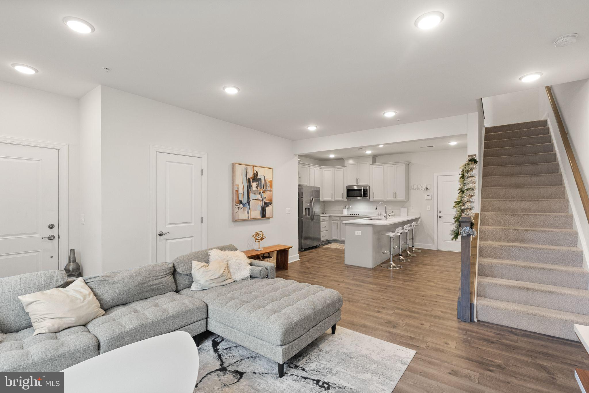 Welcome home to effortless living at this stunning two-level condo, built in 2019 and designed with style and convenience in mind! From the moment you step inside, you'll appreciate the contemporary charm highlighted by durable and stylish LVP flooring throughout. Enjoy an open and bright main level that seamlessly blends the spacious living area with an upgraded gourmet kitchen—featuring sleek quartz countertops, double wall ovens, an electric cooktop, and stainless steel appliances.
Upstairs, you'll find two generously-sized bedrooms, each providing ample space for relaxation. The bonus loft area is perfect for a home office, cozy second living space, or a playroom—and it could easily be enclosed to create an additional bedroom! The upper level also features two large bathrooms and the convenience of a full-size stackable washer and dryer.
Step outside to unwind on the beautiful balcony just off the loft, ideal for your morning coffee or evening relaxation. A convenient one-car garage and additional driveway parking make coming home stress-free.
Located in a prime commuter location, you're just minutes from the Manassas VRE station and major routes including 28, 66, and 234. The charm of Old Town Manassas, with its delightful local restaurants and unique shops, is just a quick drive away. Plus, you're only a stone’s throw away from the popular entertainment hub featuring 2 Silos Brewing Co., Farm Brew Live, Black Sheep Restaurant, Proof, and the brand new MurLarkey Distillery.
Don't miss the chance to call this modern gem your own!