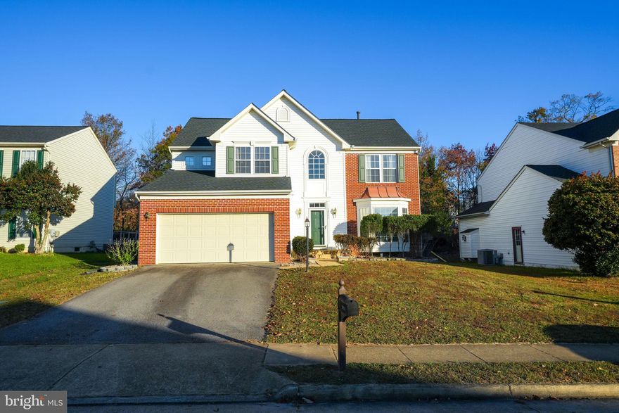 Beautifully renovated  home in Brooke Farm offers over 3,000 sq ft of living space. Walk in to an open foyer and enjoy the warmth of hardwood floors throughout. Spacious family room off the kitchen has a cozy gas fireplace. The kitchen boasts granite countertops, stainless steel appliances, an island for added counter and cabinet space, and opens up to the airy sunroom with walkout to the patio. Wine room off of the kitchen features pine paneling and is temperature controlled to keep your collection just right. Upstairs, the primary suite is a retreat with a sitting nook, vaulted ceilings, walk-in closet with organizers. The ensuite bath speaks luxury with a large soaking tub, double sinks, glass shower, bluetooth speaker, and heated flooring. Find three more sizable bedrooms and a fully renovated hall bath with glass shower. The basement is all about fun, featuring a rec room, bonus room, wet bar, and a setup for a projector with speaker system. Walkup to the rear yard.  With a 2-car garage, mudroom, main level laundry, and easy access to commuter routes like I-95, Old Bridge Commuter Lot, the VRE train, and the beauty of Occoquan this home is both convenient and inviting. Be sure to check out the 3D Tour!