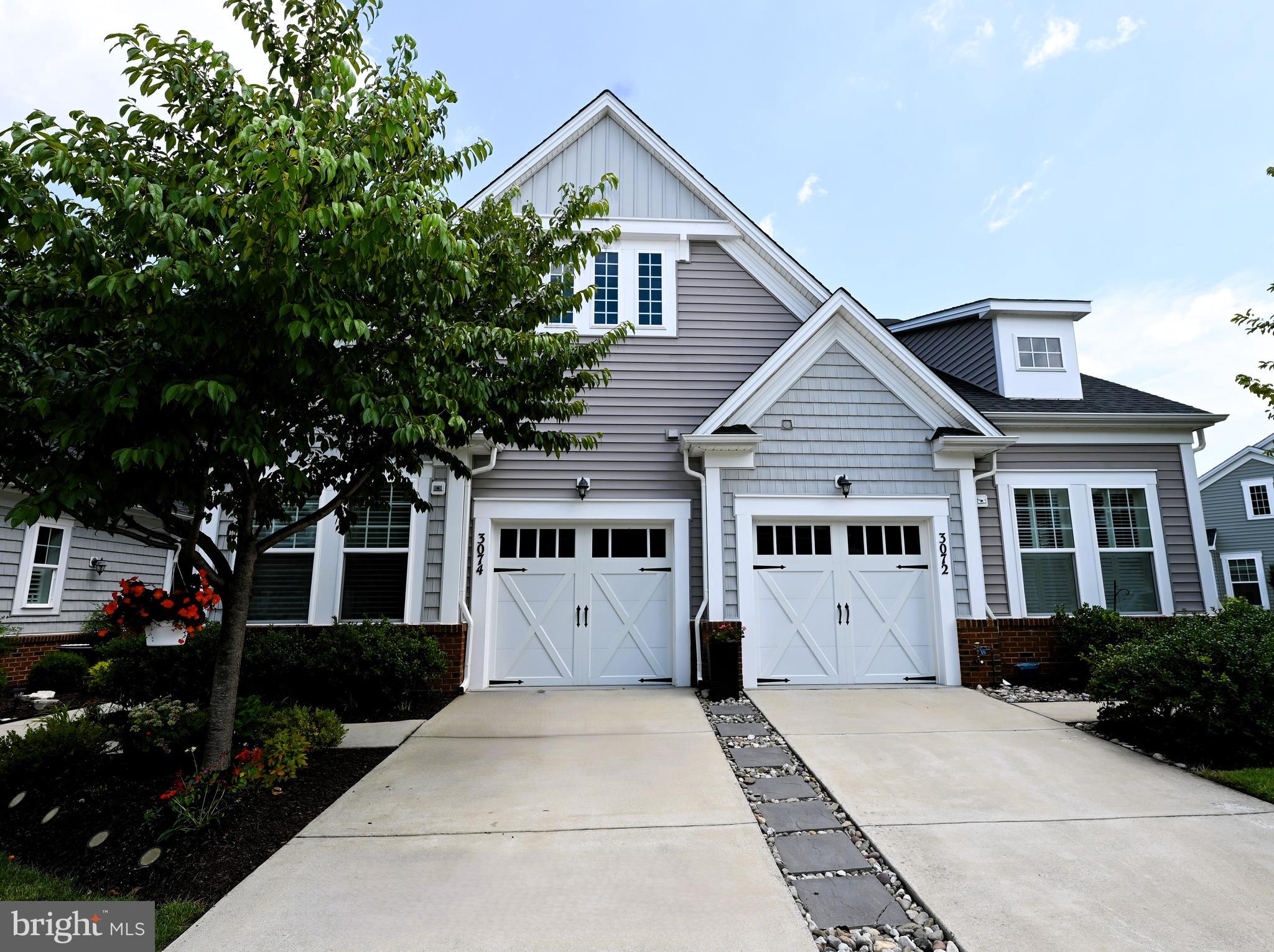 Welcome to your new home with its very own backyard oasis! Come see this beautiful gem in the sought-after 55 and older community of Two Rivers. This Community offers pools-indoor and outdoor, recreation facility, Club House, exercise room, fitness center, jogging/walking paths, tennis courts, snow removal, trash removal, and so much more!
The main level of your new home offers the living room, dining room, and kitchen combination, which is very open and welcoming, and the Silhouette blinds will blend in with any decor. The kitchen boasts granite countertops, stainless steel gas stove with oven, dishwasher, and refrigerator-all top of the line, and upgraded soft-touch cabinets. Enjoy a very large center island with a seating area too!
This unit is one of the few units that has a private sunroom for you to enjoy in the summer or the winter. You step out of your sunroom to enjoy your very semi-private patio area fenced on both sides with a paver fence at the back and with beautiful and colorful flowers. Enjoy your view of openness and some mature trees. You are not looking into your neighbor's house! The ensuite has a private bathroom and walk-in closets all on the first-floor entry level. Parking is a driveway and a single car garage with remote control entrance! Please view pictures for a better visual of this unit. The upstairs has a semi-private loft, which is not being used as a bedroom.