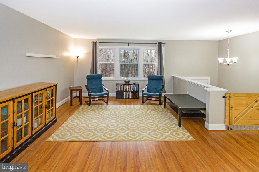 Don't miss out on this bright and beautiful 4 bedroom, 2 full bath split-foyer single family home nestled within a large, private 3.5+ acre wooded lot. Fully renovated in 2019, this home features gleaming hardwood floors throughout the open floorplan, including a spacious kitchen, dining room, living room, and plush carpeting in the bedrooms. The lower level offers an additional bedroom, ample storage, and a newly installed pellet stove warms the spacious recreation room that's flooded with natural lighting from the large windows. The walkout basement opens to a concrete patio and backyard.