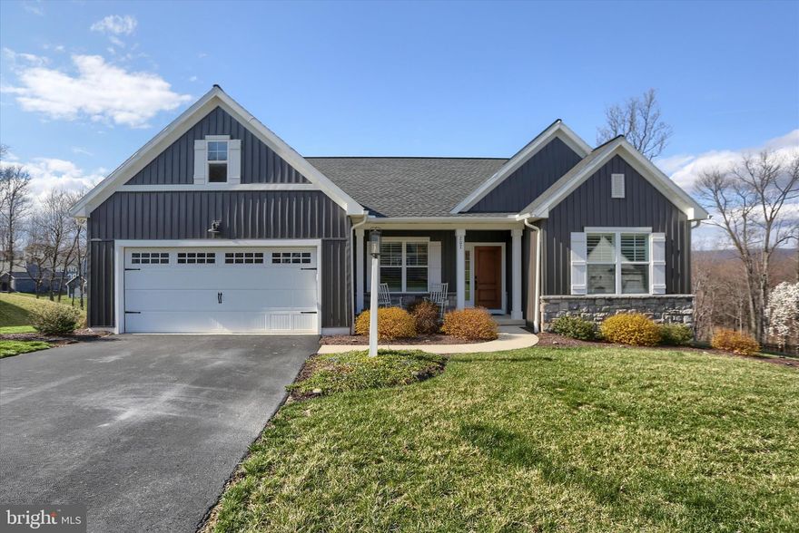 Located at 207 Rockville Blvd in the desirable Rockville Estates neighborhood of Marysville, this cozy and well‑appointed home offers an inviting layout highlighted by soaring cathedral ceilings, engineered hardwood floors, newer carpet, and thoughtful lighting upgrades throughout. Window treatments include elegant plantation shutters, while the living area is anchored by a striking stone fireplace with an oversized mantle. The expanded kitchen is designed for both function and style, featuring quartz countertops, glass‑front cabinetry, an oversized island, newer GE appliances, and a walk‑in pantry. The luxurious primary suite is a true retreat with a wood‑inlaid tray ceiling, dual walk‑in closets, and a private bath showcasing Corian countertops and sinks along with a full tile shower. Poured concrete walls add durability and energy efficiency, while the huge walkout basement is partially finished, providing flexible space and abundant storage. Outdoor living is enhanced by a newer Timber Tech deck with a privacy wall, overlooking a wooded rear lot with scenic river views. Additional features include a two‑car garage and driveway, completing this thoughtfully upgraded home in a beautiful setting.