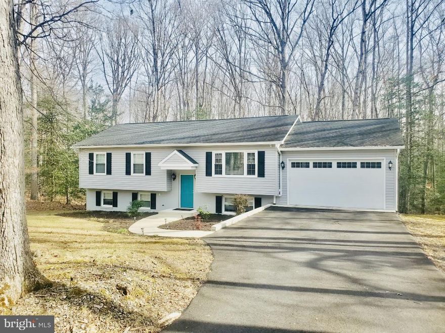 Nestled on a quiet, secluded street near historic Chancellorsville Battlefield, this 4-bedroom, 3 full bath bi-level home sits on a beautifully wooded 3-acre lot offering privacy and tranquility. Features include large kitchen flowing to family room, beautiful deck off the kitchen, lower level is very spacious with two bedrooms and full bath,  a garage, flexible living spaces, and a peaceful natural setting. Conveniently located with easy access to I-95, shopping, and dining. A rare opportunity for private living with excellent commuter access. Photos coming as soon as possible due to snow storm!