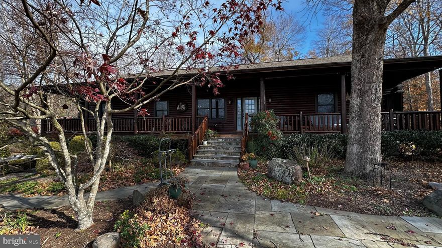 Nestled on 10 acres of untouched land, this charming log cabin is the perfect retreat for those seeking peace and privacy.  Spanning 3,000 square feet, it offers four cozy bedrooms, office space, sunroom and two full bathrooms, ideal for families or entertaining.  A large front porch invites relaxation while soaking in the natural beauty.  Tucked away on a private road, this home ensures seclusion and tranquility. Inside, a warm, rustic ambiance awaits, with an open space living room—perfect for cozy evenings. The spacious finished basement provides ample storage or potential for additional living space, while the expansive lot offers endless outdoor opportunities. A workshop is also included, making this property a true haven for nature lovers and hobbyists alike.  No smoking/vaping inside.  Don't miss the chance to call this beautiful property home!