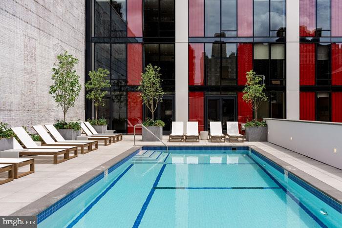 Center City’s Crown Jewel: 210 South 12th. A once-in-a-lifetime opportunity.
Nestled in the vibrant heart of Midtown Village, 210 South 12th stands as a beacon of modern living, embodying an unparalleled residential experience. This prestigious address is renowned for its sophisticated living spaces, which include everything from sleek studio apartments to expansive three-bedroom penthouses and everything in between.
The stunning architecture of 210 South 12th was finely crafted by a team of elite design professionals headlined by award-winning firm RSHP, formerly known as Rogers Stirk Harbour + Partners, Midwood Design Studio, and BLT Architects. World-class elegance combines with the character and soul of one of America’s most vibrant cities to create 32 floors of innovative living.
Located within the Washington Square West neighborhood, this apartment community integrates modern design and convenience into every element, offering studio, one-bedroom, one-bedroom den, and two-bedroom apartments as well as impressive three-bedroom penthouses. Residents are greeted with a 24-hour attended lobby with concierge services, providing a welcoming entrance. At 210 South 12th, you’ll enjoy personalized comfort year-round thanks to state-of-the-art air conditioning and keyless entry with smart controls.
Cycling enthusiasts will love the ample bike storage. And those with a competitive spirit will revel in a recreational haven complete with billiards, ping pong, and shuffleboard. When you’re ready for a quiet retreat, visit the cozy library aside the fireplace overlooking a living green wall, catering to both literary pursuits and relaxation.
The dynamic co-working lounge is tailored for modern professionals, while breathtaking distant views encompass bridges, the river, and the city skyline as a visual retreat. The community includes a dedicated dog park and spa, ensuring that furry residents are well cared for.
Additional bragworthy amenities enhance convenience, including a 100% EV-equipped fully automated parking garage, a smart package room for secure deliveries, resident storage lockers, a spin studio, a yoga room, sauna, and a state-of-the-art fitness center.
Dining is elevated to an art form with an exquisite gourmet catering kitchen and a poolside lounge with its own catering equipment. Outdoor amenities create a resort-like atmosphere with a pool, sunbathing areas, a sundeck, and an outdoor cinema.
For private gatherings and business meetings, spaces like dining rooms, meeting rooms with wet bars, and conference rooms are designed to accommodate your needs.
210 South 12th Street caters to the diverse needs and interests of its residents, transcending traditional apartment living and setting a new benchmark for luxury, comfort, and design in Philadelphia's Center City.
* Photos are of model units ** Pricing and availability subject to change on daily basis ** Parking may be available for additional fee **