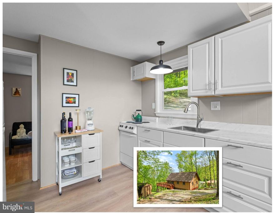 This beautifully renovated A-Frame with a loft is ready for your perfect summer getaway! Nestled in a peaceful, wooded, and private setting in the Blue Mountain area of Front Royal, this home offers a serene escape where you can unwind to the soothing sounds of the wind through the trees and nature’s chorus. Enjoy over 400 square feet of deck space, ideal for relaxing or entertaining.

As part of a welcoming community, you’ll have access to Blue Mountain Lodge and Deer Lake, oart if a POA, which features a beach and waterfront access for added outdoor fun. The oval gravel driveway, improved in 2020, provides easy access to the home.

Inside, the vaulted beamed ceiling creates an open and airy atmosphere, while large windows bring the beauty of the surrounding nature indoors. The main floor includes two comfortable bedrooms, plus a loft that offers flexible space for extra sleeping, an office, or a lounge area. The kitchen was fully remodeled in 2025 with modern finishes, complemented by a new tankless water heater and fresh contemporary paint throughout the home from the same year. Key updates also include an inspected & updated septic system in May 2026, complete replumbing in 2014, and a roof installed in 2010.

Explore Northern Virginia’s Wine Country or enjoy nearby outdoor adventures including hiking, Shenandoah National Park, canoeing and kayaking on the Shenandoah River, Skyline Drive, Skyline Caverns, and the Appalachian Trail, all within easy reach. Don’t miss a visit to the famous Apple House just minutes away for their legendary apple butter donuts. Birdwatchers will delight in the opportunity to spot a variety of species right from the balcony with your binoculars.

Check out the adjacent 1.38 Acre lot VAWR2014032