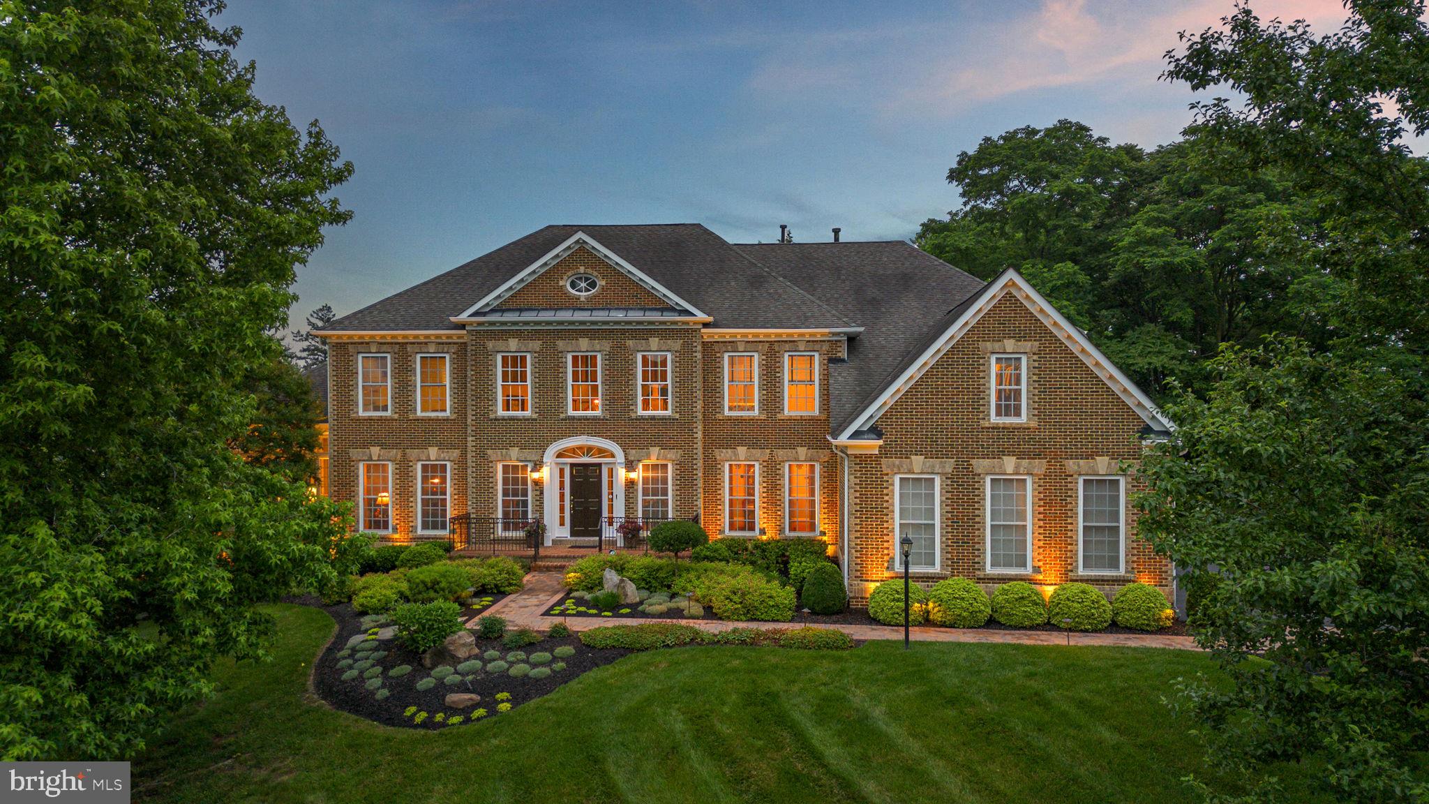 Welcome to 21816 Gaithers Meadow Lane in Brookeville, Maryland—conveniently located between Baltimore and Washington, D.C. Majestically set on 1.38 acres of beautifully landscaped grounds, this luxurious brick-front estate offers timeless elegance and nearly 8,000 sq ft of finished space. With 5 bedrooms and 5 full bathrooms, this home includes 4 upper-level bedrooms each with private en suite baths, plus a 5th bedroom and full bath on the finished lower level—perfect for guests or extended living. The striking brick exterior is complemented by extensive hardscape, structured plantings, and natural stone elements that create a grand first impression.
MAIN LEVEL:
Enter into a dramatic double staircase foyer with hardwood floors and soaring ceilings. Expansive living spaces include a formal Living Room, sun-drenched Sunroom with tray ceiling, private Library, and a stunning 2-story Family Room with a wall of windows and fireplace. The chef’s Kitchen features Thermador and Wolf appliances, double granite countertops, a center island with seating, walk-in pantry, and a cabinet with lift-up appliance storage. A sunny Breakfast Room opens to a vaulted Florida Room and a two-tier deck overlooking the private backyard. Additional highlights include a coffee bar, butler’s pantry, rear staircase, Powder Room, and a large Laundry/Mud Room with cabinetry and utility sink.
UPPER LEVEL:
The expansive Primary Suite is a true retreat, offering a Sitting Room, two custom walk-in closets, dressing room with triple mirrors, and a spa-like bath with soaking tub, oversized frameless glass shower, dual vanities, private water closet, and tray ceiling. Three additional bedrooms, each with en suite bath and walk-in closet, complete this level. Overlooks to both the foyer and family room below fill the space with light.
LOWER LEVEL:
Designed for entertaining and multi-functional living, the lower level offers a Media Room with fireplace and walk-out access to the patio, a large Rec Room, full Bar with dishwasher and refrigerator, and a Wine Cellar with tasting area. The 5th bedroom and full bath are ideal for guests or an au pair. A spacious Exercise Room offers flexibility for a gym or indoor recreation.
EXTERIOR:
Enjoy multiple outdoor zones including a two-level deck, lower patio, and lush tree-lined landscaping. The attached 3-car garage and extended driveway provide ample parking.
RECENT UPGRADES & FEATURES:
Re-landscaped front & sides with underground drainage, irrigation, and exterior lighting
3-zone HVAC & whole house humidifier (2023)
New wood flooring in upper bedrooms (2024)
Hot water heater (2021)
Toto toilet seats (2020)
Wider stone walkway (2020)
Luxury engineered wood flooring & gym rubber flooring (2022)
ADT custom 36-zone security system
Exterior storage shed with ramp & gas generator
Six TVs (4 Samsung, 2 Sony) and 2 Sonos soundbars convey
TOP-RATED SCHOOLS:
Sherwood Elementary, Farquhar Middle, Sherwood High, plus nearby private options such as Good Counsel, Friends School, and St. John’s Episcopal.
Meticulously maintained and thoughtfully designed—this is luxury living at its finest.