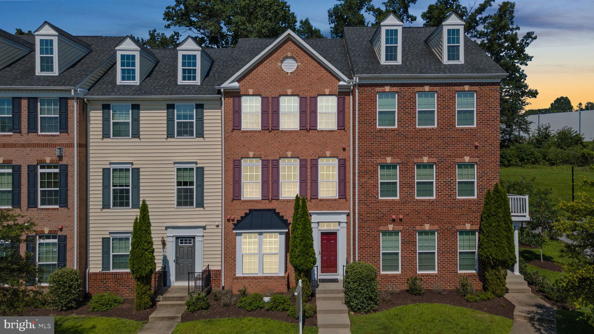 Welcome to RAINCLIFFE, located in the charming historic section of Sykesville! This beautifully maintained 3 BR, 2 full & 2 half BA townhome is nestled in a highly sought-after and convenient neighborhood. A rear-entry 2-car garage opens to a finished lower level with a rec room, half bath, and laundry area—ideal for flexible living. The main level features hardwood flooring, high ceilings, and an open-concept layout. The gourmet country kitchen offers granite counters, stainless steel appliances, and a center island, flowing seamlessly into the bright living and dining areas. Step out to the rear deck—perfect for entertaining or relaxing. Upstairs, the spacious owner’s suite includes a soaring cathedral ceiling, walk-in closet, and luxurious bath with dual vanities, soaking tub, and separate shower. Two additional bedrooms and a full hall bath complete the upper level. Just a short walk to Freedom Park and minutes to downtown Sykesville, Piney Run Park, shopping, and major commuter routes. This home blends comfort, style, and convenience—don’t miss it!