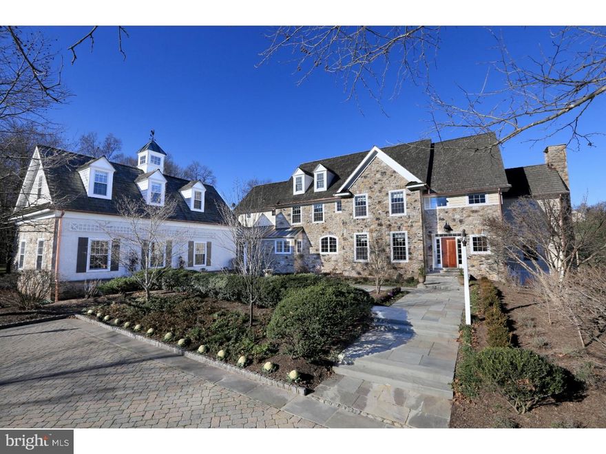 Past the gate and down a tree lined drive, for the first time offered since built this fine Solebury estate home is available and offers a new open-plan kitchen, fully finished walk-out lower level (with full bar and wine cellar), and plenty of living space.  Enter through the grand foyer featuring an 18' ceiling and you will find freshly finished hardwood floors throughout the main level, a new top line kitchen with 6 burner + griddle Wolf gas range (dual fuel, double oven), quartz counter tops, all new custom cabinetry with under cabinet lighting and electric, a large farm-style sink overlooking the front terrace, and a sous-chef prep area with a second sink.  A built-in wine fridge and microwave are found in the over-sized island (perfect for entertaining and offering tons of storage), this modern style kitchen flows into the breakfast room and opens into the sun-filled, sunken Great Room. Custom trim work, wainscoting and built-ins throughout, including in the large formal dining room and the first floor office which overlooks the grounds and is accented by a gas fireplace. A cozy family room is located just off the doors to the outside stone terrace and surrounding grounds. Upstairs you will find a large master suite with 12' tray ceiling, gas fireplace, and an ensuite sitting/bonus room, double walk-in closets and master bath featuring double vanities and a claw foot tub. Of the additional bedrooms, two also have high vaulted ceilings and one features a loft. Above the garage you will find the perfect in-law/au pair/guest suite: a fifth bedroom with its own kitchenette, full bath, and living room with a beautiful vaulted ceiling created by the cupola on the roof. The fully finished, walk out lower level offers a media room, game room sized for a pool table, full bar with mini fridge and kegerator, and a 1,500+ bottle climate controlled wine cellar. Luxury living at its finest awaits in low-tax and top rated NHS school district, just minutes from major commuting roads to NJ/NYC and the greater Delaware Valley.