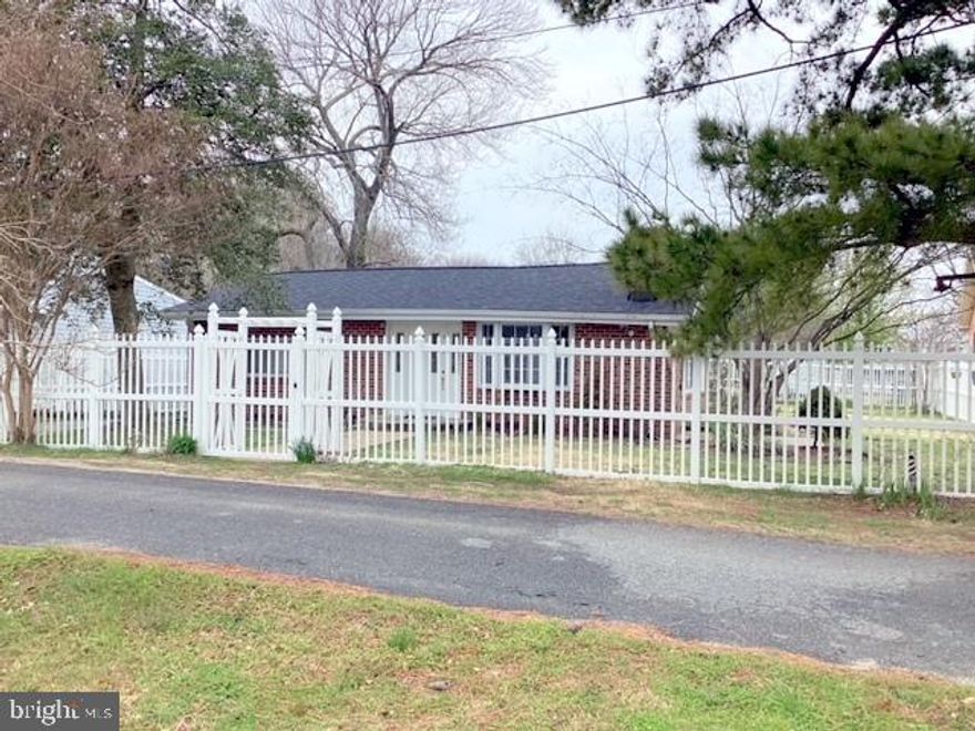 LOCATION! LOCATION! VERY QUAINT BRICK RAMBLER WITH WATERVIEW OF CHESAPEAKE BAY! Charming 2 BR, 1 Full BA, Sunroom off Kitchen , Detached  Garage w/ Hobby room and close to 2 Beaches and   Marina. This Cottage style rambler has a new roof on level lot located on no thru street in the Long Beach Community.  2BR,1BA, OVER SIZED DETACHED GARAGE WITH HOBBY ROOM. SUNROOM WITH DOOR TO ACCESS BACK YARD OFF KITCHEN w/CERAMIC TILE, LIVING ROOM W/ FIREPLACE, PARQUET FLOORING IN KITCHEN & LIVING ROOM, 6' VINYL FENCED IN PROPERTY. NICELY LANDSCAPED, MANY FRUIT TREES (apple, pear & fig). NEW CARPET, PAINT and NEW WASHER & DRYER. CLOSE TO FLAG HARBOR MARINA, COMMUNITY BEACHES AND BOAT RAMP.  CALL TODAY FOR APPOINTMENT TO SEE. Some Pictures are from summertime a few years ago. This is an "AS IS" sale.