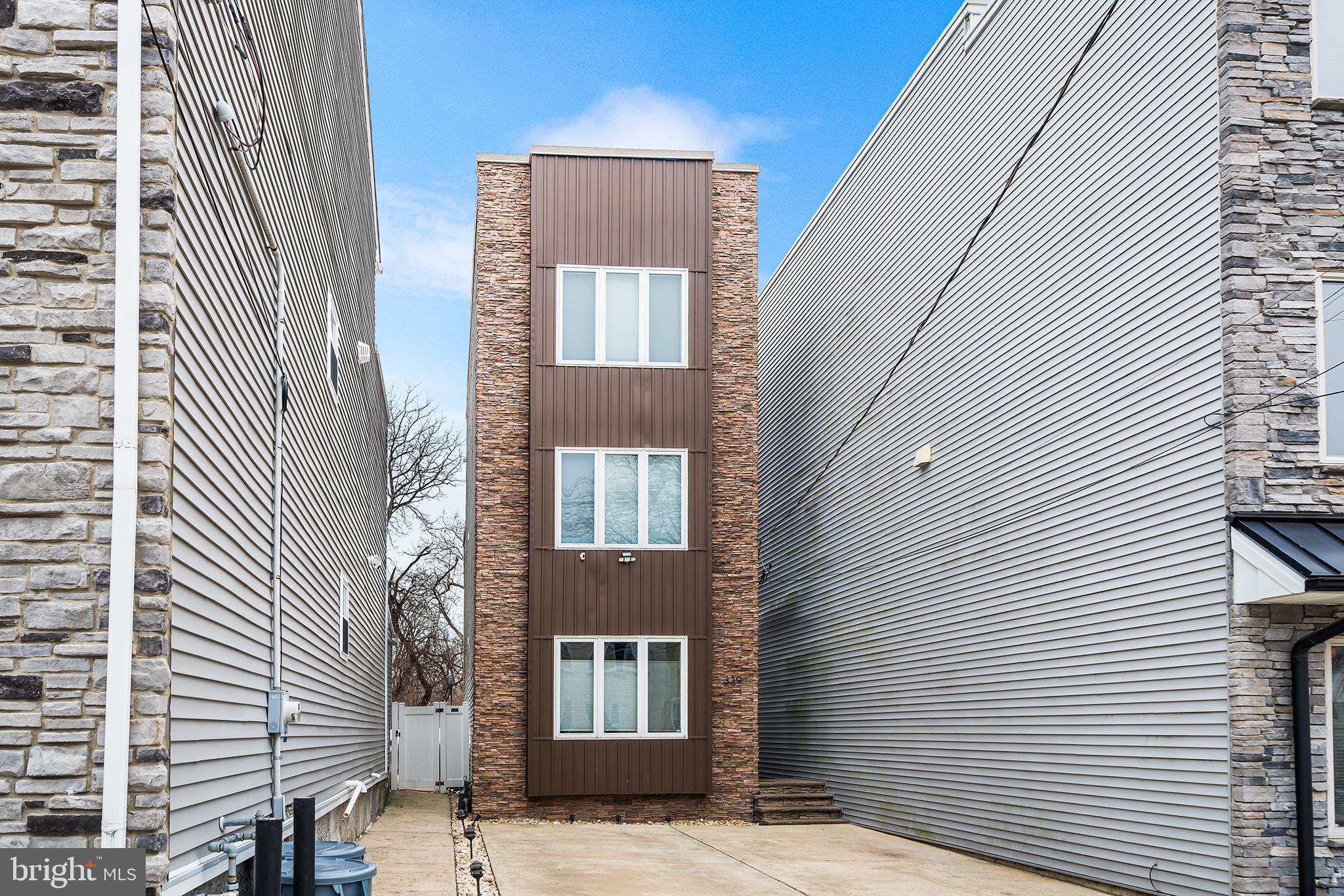 Welcome to 339 Delmar St, a stunning contemporary detached home in the Roxborough/Manayunk neighborhood. This home offers a harmonious blend of modern design and comfortable living and with 4 spacious bedrooms and 2.5 bathrooms, this home is perfect for those seeking ample outdoor space!
Step inside to be greeted by high ceilings and an open-concept living area that features elegant hardwood floors and recessed lighting, creating a warm and inviting atmosphere.
As you walk through the dining area and into the gourmet kitchen, you'll immediately notice its charm. Fully equipped with stainless steel appliances and granite countertops, the open kitchen design makes it perfect for entertaining guests or enjoying family meals. Completing the main floor, you'll find a powder room, closet and an exterior door leading you to your deck and backyard. As you walk out the back, you'll notice the deck that leads to your backyard. A white picket fence allows for privacy and plenty of space to make your outdoor design dreams come true.
Head upstairs to the second floor where you'll find 3 large bedrooms, a full bathroom and closet that perfectly fits your washer/dryer.
Retreat to the primary suite on the 3rd floor to find your walk-in closet and a luxurious ensuite bathroom featuring a soaking tub and double sinks. Exit onto your TWO rooftop decks from the 3rd floor that are ideal for relaxing or hosting gatherings. The first rooftop deck, off the primary bedroom, overlooks the backyard and the top rooftop deck is the size of the ENTIRE roof and allows for 360 degree views of the beautiful skyline.
The home also includes a full and finished basement. This is currently set up as a gym and a bonus lounge area. This space gives you options to do what fits your lifestyle while providing ample storage and additional living space.
All of this and the ability to walk to downtown Manayunk, the Manayunk train station, Schuylkill River Trail and more! Don't miss the opportunity to make this exceptional home yours!