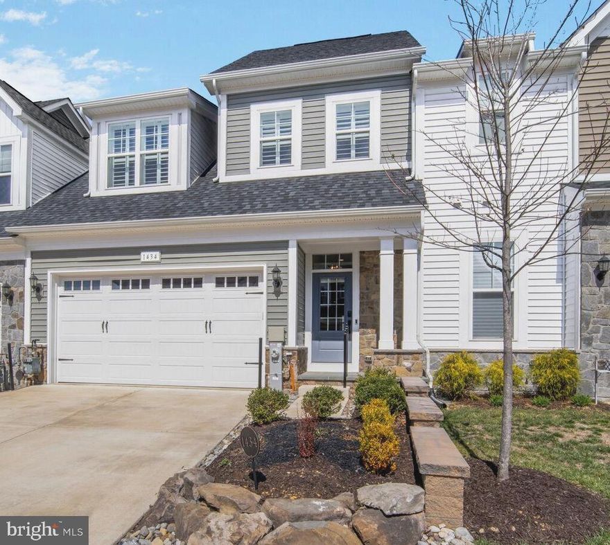 Price Improvement!  This beautiful elevator townhome is located at 1434 Bed Stone Lane in The Watershed section of Two Rivers.  It offers a perfect blend of elegance and comfort, featuring three spacious bedrooms and three and a half baths across three finished levels. The light-filled interior is warm, inviting, and sophisticated, with every detail thoughtfully designed. The gourmet kitchen boasts a large island with stunning quartzite countertops, ideal for both cooking and entertaining. The living room is complemented by custom-built cabinetry, while the solarium fills the space with natural light, creating a serene retreat. Throughout the home, plantation shutters provide timeless elegance to the windows, and the lower level features built-ins, a bar, and wine refrigerators, making it perfect for entertaining. A cozy Florida room and a separate exercise room offer additional spaces for relaxation and wellness. The home is also equipped with a whole-house generator, ensuring comfort and peace of mind. Located in an amenity-rich 55+ community, you'll enjoy access to both indoor and outdoor pools, a clubhouse, pickleball courts, tennis courts, a dog park, walking trails, and so much more, offering the ultimate in luxury living and convenience.