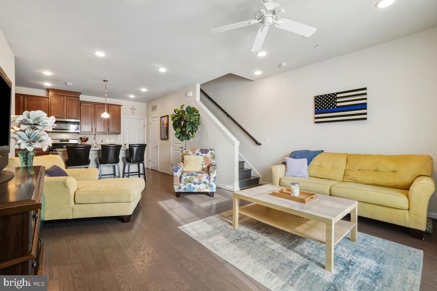 Immaculately cared for by its original owner, this Pulte-built Lafayette ground-level unit is truly move-in ready. The southeast-facing home offers two sun-drenched levels spanning 1,516 square feet, with 3 bedrooms and 2.5 baths. Interior highlights include stainless steel appliances, hardwood flooring, upgraded oak stairs, and white pearl granite countertops. The washer and dryer are conveniently located on the bedroom level. A one-car garage provides direct access into the kitchen for added ease.

Residents of Clarksburg Town Center enjoy resort-style amenities including a community pool with beach-style entry, clubhouse with fitness room, playgrounds, pocket parks, scenic walking paths, open green spaces, and a pond with pier, along with year-round community events. Ideally located near I-270 and Route 355, Clarksburg Premium Outlets, and Milestone Shopping Center, with future proximity to the highly anticipated Clarksburg Town Center.