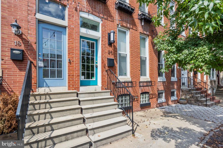 Don't miss this solid brick townhome in the neighborhood of Butchers Hill. Upon entry, you will be welcomed with an open floor plan, a formal living room with exposed brick and wood floors, separate dining room,  powder room and a nice sized kitchen kitchen with ceramic tile floor, granite countertops and stainless steel appliances. The upper level showcases a full bath, a primary bedroom with wood floors and built-in closet, and a 2nd bedroom with carpet floors.  While the partially finished lower level has a recreation room and a utility room.  The rear yard has space for parking. To help visualize this home’s floorplan and to highlight its potential, virtual furnishings may have been added to photos found in this listing.