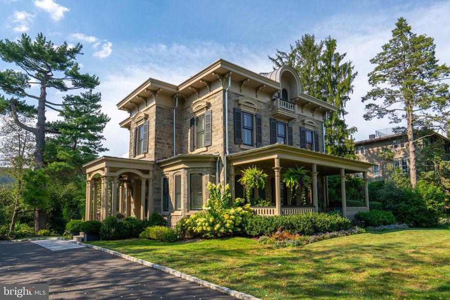 Magnificent historical gem located in the very heart of Chestnut Hill. The "Hart House" was originally built in 1861 for manufacturer Norman Hart, and meticulously renovated to perfection in 2017 by award winning builder Blake Development.  This beautifully maintained home is the perfect blend of classic architectural appeal and modern design. Approaching this home, you'll be captivated by its timeless curb appeal. The Wissahickon schist exterior, extensive landscaping & hardscaping, flickering gas lamps, and covered mahogany front porch showcases a classic elegance and welcoming aura. Step inside, and you'll immediately fall in love with approx. 5,000 sf of intricate detailed perfection. From the marble floored Foyer, the soaring 10+ ceilings, the gleaming hardwood, and the detailed moldings & mill work throughout, the owners have spared no expense to make this home truly one of a kind. The well-appointed gourmet Kitchen is a chef's dream, boasting custom cabinetry, marble counters, large center island with seating, premium stainless appliances, Wolf Gas Range with Hood, Sub-Zero Refrigerator, Bosch Dishwasher, subway tiled backspalsh, and large Butler's pantry with extra counter & cabinet space with beverage storage. The Kitchen seamlessly transitions to the expansive Family Room with gas fireplace, hardwired Stereo System speakers, and access to the private flagstone terrace outside. The formal Dining Room creates an inviting atmosphere for family gatherings and entertaining guests. After dinner, escape to the relaxing Living Room space with its own gas fireplace, or head to the tucked away Office with ample built-ins. Upstairs, you'll find 4 comfortable Bedrooms, highlighted by the spacious Primary Suite with ceiling fan, recessed lighting, Walk-In Closet & organizing system, and ensuite Bathroom with dual vanity, glass enclosed shower, soaking tub, and radiant heated flooring. Each bedroom offers generous closet space and large windows, allowing for plenty of natural light. The second floor rooftop garden is its own amazing outdoor oasis, while the finished lower level offers plenty of extra storage and cubbie space, Wine Cellar, Hobby Room, and large 2-Car Garage. This custom home offers 2-zoned Lennox HVAC(s), Pella windows, and security system. You're just steps away from all Chestnut Hill has to offer with easy walkability to boutique shopping, fine dining, street festivals, Chestnut Hill Farmers Market, beautiful Wissahickon Valley Park, Chestnut Hill West AND East Regional Rail lines. It's lifestyle living at its finest! Don't miss this opportunity to claim a piece of Chestnut Hill's storied history.