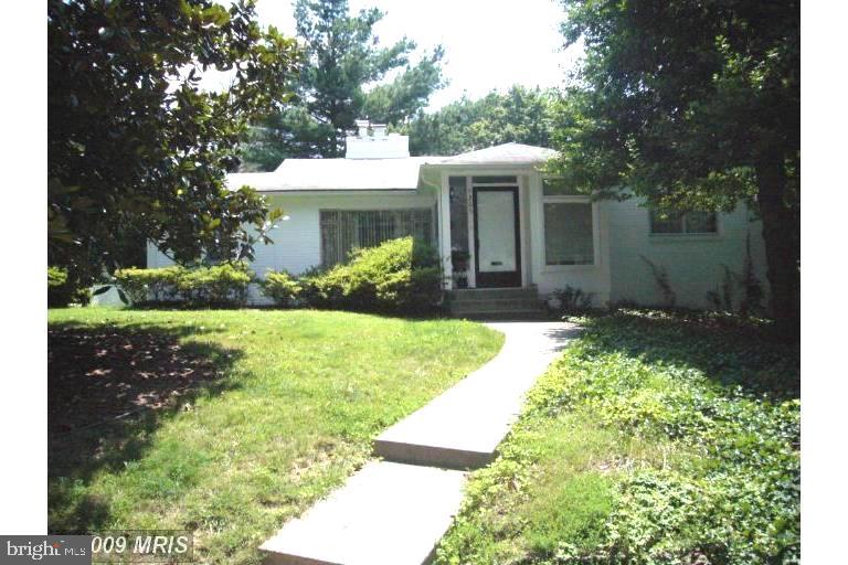WALKING DISTANCE TO FRIENDSHIP HEIGHTS METRO! Residential setting just a block off River Road; Kitchen UPGRADED WITH QUARTZ COUNTER, TILE BACKSPLASH AND STOVE has cute breakfast nook with windows all around; Medium sized bedroom with en-suite bath; two more bedrooms and a RECENTLY REMODELED HALL BATH; Den/Sun room too! Alley behind the house and off street parking. Paver Patio; spacious rec room plus half bath on lower level. Lots of storage downstairs. Friendly neighborhood.