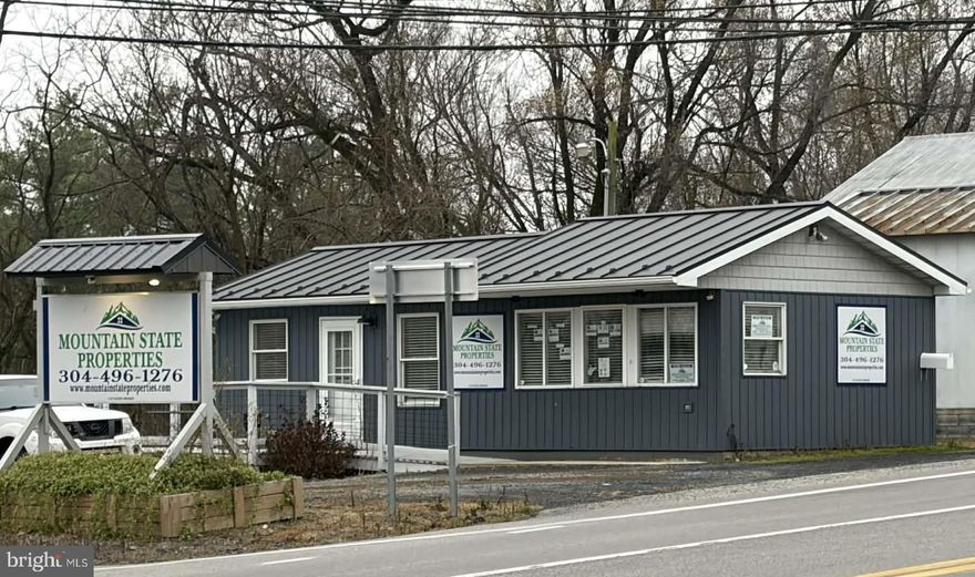 Now's Your Chance to Own a Prime Corner Lot in Hampshire County, WV! Great Location ... Busy Corner ... Rt-50 and Ford Hill Road.  This Property has lots of Commercial Potential.  .27 acre Lot.  Building features New, in 2021, Standing Seam Metal Roof, Vertical Board & Baton Siding, New Flooring, New Plumbing, New Deck.  Additional (gravel base) Parking on the Lot Behind Building with Right-of-Way Access off of Ford Hill Road.  Updated Fiber Optics via Frontier.  Large Sign on Property to Advertise Your Business with Electric run to it. Rt-50 has a Ton of Traffic coming in from Northern Virginia, etc., and is a Major Route for Our County. Lots of Windows which Allow for Natural Lighting in the Conference/Office Area. New Energy Efficient Mini Split HVAC System put in 2025.  Rough-in for a Handicap Bathroom, if needed.  There is a Large Shed for Additional Storage. Tons of Potential on this Property!  Some Furnishings may be Negotiable. Snatch It Up While You Can!