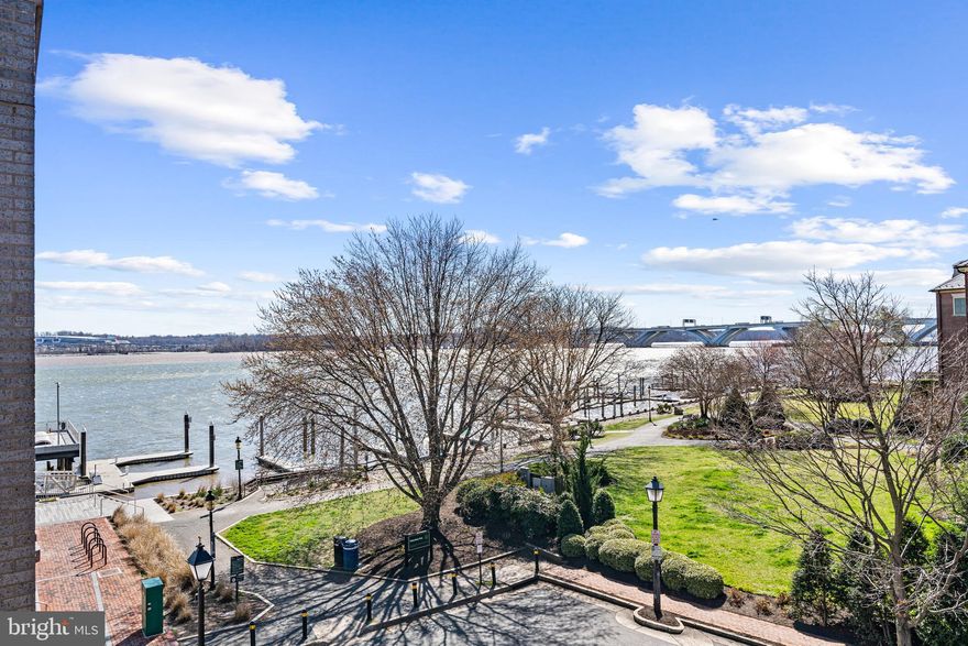 Robinson Landing located at the SE Quadrant of Old Town, is the epitome of luxurious WATERFRONT living.  Building 2, where this residence is located, is a testament to the developer's commitment to providing residents with the WATERFRONT living experience.  This unit,  at the end of Wolfe St, affords a water view from the  balcony  & primary bedroom, facing SOUTH, draws on the wonderful sunlight.   The 83 sq ft BALCONY is uniquely equipped with a GAS LINE for a grill!  Designed with convenience for single-level living, the open-concept floorplan features FLOOR-TO-CEILING windows and WIDE-PLANK wood floors, creating an elegant atmosphere. The Snaidero cabinetry, HIGH-END Thermador/Bosch appliances, paneled refrigerator & dishwasher and WATERFALL edged kitchen island, in the chef's kitchen make it a culinary haven, while the gas line on the balcony offers the ultimate convenience for GRILLING enthusiasts. The primary bedroom is a haven of relaxation, offering a VIEW of the RIVER through its ceiling-to-floor windows. The CUSTOM shelving in the walk-in closet and Hunter Douglas blinds are just some of the thoughtful touches that make this residence truly exceptional. The primary bath is EUROPEAN inspired, with its wall-mounted floating dual sink, recessed lighted medicine cabinets, and oversized frameless shower enclosure. The second full bath also echoes similar luxury features as the primary bath.  You have the luxury of 2 DEDICATED parking spots along with an EV charger, courtesy of the sellers.   This unit also comes with a 12’ x 10’ (approx.) STORAGE room directly in FRONT of the parking spots - which is a rarity!
Building 2 offers more than just a beautiful residence; it also provides residents DIRECT access to state-of-the-art fitness facilities, a yoga studio, lounge, and dog wash and spa. Biking enthusiasts can take advantage of the dedicated storage for their bikes, while car enthusiasts have two dedicated parking spots, complete with an electric vehicle charger. The community amenities are equally impressive, with 24-hour CONCIERGE service; centralized package and mail delivery management; long-term vacation mail/package management; fitness center; meeting/lounge room; yoga room; dog spa - Yes! dog spa!
LOCATION: On the waterfront, 2 blocks to King Street, 3 blocks to King Street Trolley pick up, approx: 1.3 miles to King Street Metro,& approx 3.5 miles to DCA.