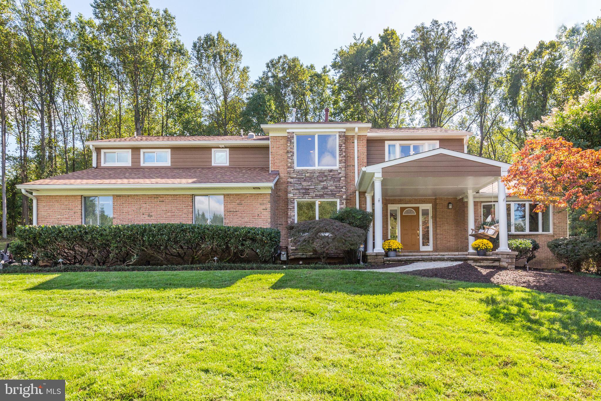 Impressive Sandy Spring-built Craftsman Colonial with a serene 2-acre lot on a cul-de-sac, backing to mature trees and the scenic Falls Road Golf Course. This expansive home offers an exceptional blend of space, comfort, and natural beauty, featuring 5 generously sized bedrooms and 4.5 baths, including a primary bedroom suite with dressing room and updated bath and lower-level guest suite. The welcoming front porch sets the tone for this remarkable home! The tastefully updated kitchen is a chef’s dream, equipped with a Wolf cooktop, built-in microwave, stainless steel appliances, custom cabinetry and pantry, granite countertops, an oversized sink, pass through window (2021) to outside grill station (2024), and a gas fireplace. The spacious island, breakfast room, wet bar with a mini refrigerator, instant hot water, and ice machine offer additional convenience and luxury. Enjoy the tranquil views from the vaulted ceiling family room, where walls of windows bring the peaceful setting indoors. The formal dining room and inviting living room with a striking stone fireplace provide perfect spaces for entertaining. For those who work from home, the main level offers a private study and a dedicated office, ideal for productivity. Skylights in the primary suite, the upper landing, and the dual-entry bath enhance the sun-filled rooms with natural light. The charming sunroom with skylights (2020) is the perfect space for relaxing and soaking in the beautiful surroundings. The lower level has been thoughtfully updated with luxury vinyl flooring, a renovated full bath (2020), an Ela system for organized storage, a workshop, and a private guest suite. Step outside to the fantastic outdoor oasis featuring a newly installed outdoor kitchen (2024), two-tier decking, fire pit, and a gazebo with a hot tub. The fenced side yard and electric dog fence provide security and space for pets, and the 3-car garage offers ample storage and a workshop that opens to a mudroom with custom-built cubbies, storage, and utility sink. Hot Water Heaters (2023). Zoned HVAC with Dehumidifiers (2020 & 2024). Roof (2023). This property is a true luxury retreat, conveniently located in a highly sought-after school district with easy access to everywhere you need to go!