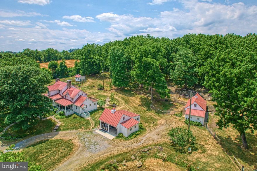 With the original section dating back to 1790 Solitude Farm enjoys rich historic charm that blends seamlessly with modern comforts.  Currently spanning 10 acres, the farm is surrounded by expansive pastures under conservation easement.  The home featuring  three bedrooms and two and a half baths welcomes you with interior stonework, wood floors  and two working fireplaces that evoke 18th century ambiance.   The current owners have made major improvements such as replacing the well and windows along with updating all baths, HVAC and electrical.  Truly ensuring that the home meets contemporary standards while preserving its historic character, the kitchen is equipped with gourmet features to delight any chef.  Outside the gardens, inspired by Williamsburg, are a testament to meticulous planning and maintenance.  They are adorned with mature hardwood trees, strong running creek and a spacious flagstone patio with stone retaining walls that seamlessly connect indoors to the outdoor garden space.   Additional amenities include a barn, run-in shed, garden shed, automatic waterers and fenced pasture catering to the practical needs of a working farm.