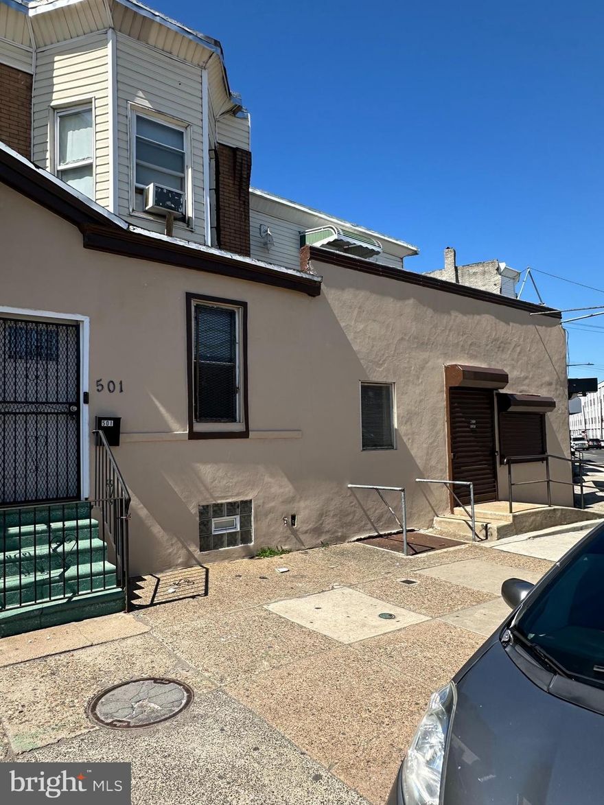 Prime mixed-use investment opportunity! Located in a high-visibility, heavy-traffic corridor in Philadelphia. This income-producing property offers a versatile storefront ideal for retail, office, or service-based use, with strong exposure and consistent foot traffic. The property features two residential units, each with separate street access for added privacy and convenience. The first unit includes one bedroom, a kitchen, a living room area, a full bathroom, and a private street-level entrance. The second unit offers two bedrooms, a living room, a full kitchen, a full bathroom, and a laundry area with all the proper hookups. Both apartments have the potential to generate a good amount of rental income!
A rare highlight of this property is the expansive private garage with capacity for at least seven vehicles. The garage is secured with a gated entrance and remote-control access, making it ideal for tenants, business use, or additional rental income. This property presents a strong opportunity for investors seeking steady cash flow and long-term appreciation. Don't miss the chance to own a well-positioned, high-potential asset in a thriving Philadelphia location!