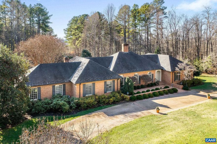 Set in total privacy and tranquility yet within a coveted Ivy neighborhood, this distinguished, all brick, one level home offers wonderful living spaces inside and out. 9 to 10 ft ceilings. Fireplaces in living, family, and great rooms. Expansive eat-in kitchen. Large brick patio and huge screened porch with tile floor overlook the dead-level rear lawn.  The almost 6 acre parcel enjoys irrigation and a deer fence.  Xfinity internet, whole house generator, plenty of storage in the basement.,Granite Counter,Painted Cabinets,Wood Cabinets,Fireplace in Family Room,Fireplace in Great Room,Fireplace in Living Room