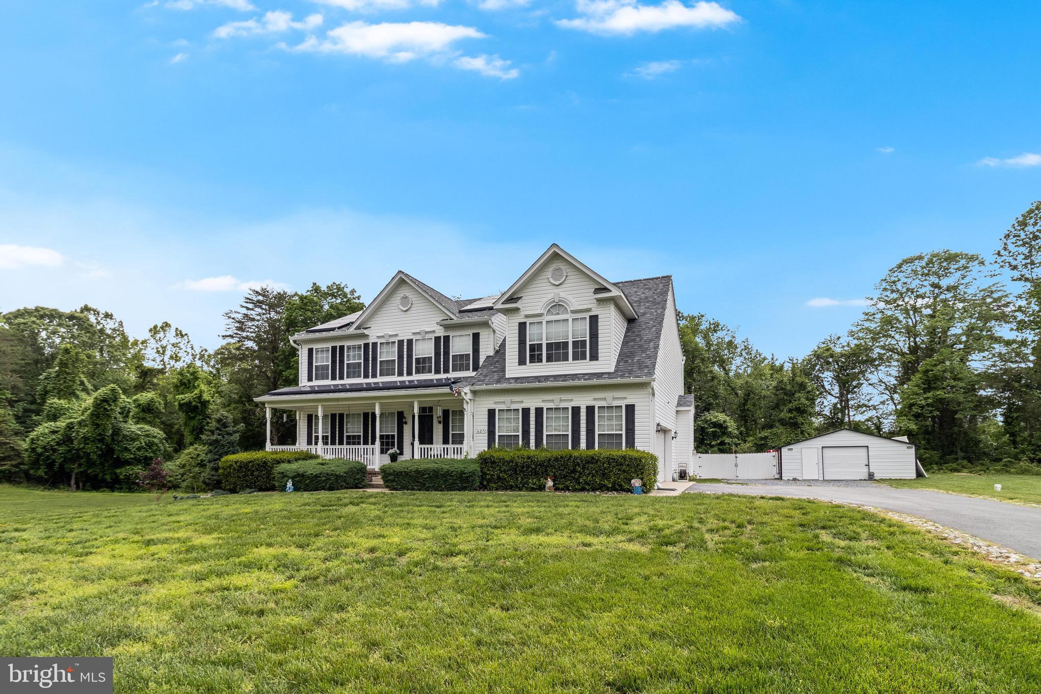 A spacious Colonial nestled on 3 private acres in a quiet Hughesville cul-de-sac. This 4-bedroom, 3.5-bath home offers a well-thought-out layout and thoughtful updates throughout. The main level features hardwood flooring, formal dining, and a bright kitchen with granite countertops, double wall ovens, and plenty of workspace. Cozy up in the living room with a built-in entertainment center and fireplace. The oversized primary suite includes dual walk-in closets, a private sitting area, and a large ensuite bath with a soaking tub, step-in shower, and dual vanities. The partially finished basement includes a full bath, storage rooms, and an unfinished bonus area ready for your vision.
Enjoy the outdoors from the screened-in back porch or the newly added paver patio just off the deck—perfect for relaxing or entertaining. The sellers also added a detached garage with an enclosed privacy fence for extra function and flexibility. A 2-car attached garage, leased solar panels for energy savings, and a beautifully cleared side yard lined with Cypress trees complete the package. Peaceful, private, and move-in ready!