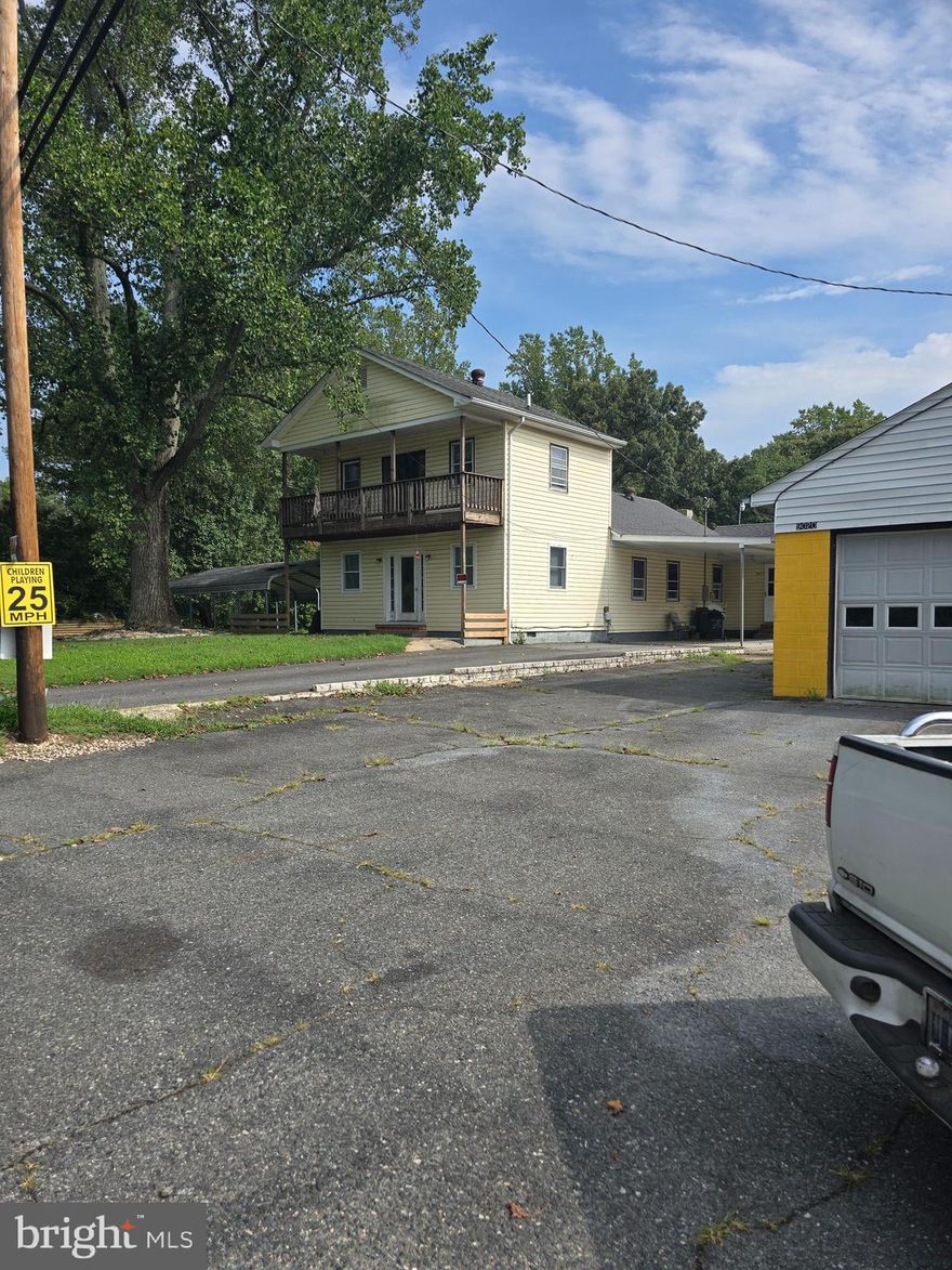 Has lots of potential ZONED C2, COMMERCIAL This 2 level house sits on almost 5 acres just on the outside of town and comes with a 7 bay Garage, One of the bays is rented out for $500 a month. This could be a great money maker, make the house a rental and use the garage for business. It has been a car lot, and a working garage for many years.  Main garage bay has a car lift and a pit. The zoning allows for all kinds of different things. Property needs some work, need some renovation but the potential for this property is limitless. THIS IS AN ESTATE SALE.