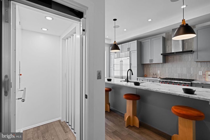 Set along the iconic Avenue of the Arts in Philadelphia’s Graduate Hospital neighborhood, the ten home collection at Lydian Place are a rare blend of elegance, modernity, and intelligent urban design. Designed by regarded Asher, Staugnwhite + Partners, the home spans over 4,000 square feet across six expansive levels connected by a private six-stop elevator, including direct access from inside the garage to easily move groceries from the car to the kitchen with the push of a button, and offers both refined living and long-term value in one of the city's most dynamic corridors. The residence welcomes with soaring ceilings, rich natural light, and a clean, modern aesthetic that allows every detail to speak. The second floor main level flows seamlessly from a generous living area anchored by a sleek gas fireplace to a dining space and custom kitchen with exceptional appliances by Bosch, Wolf and Sub-Zero—crafted for the way we entertain now, with form and function perfectly in balance. A full-floor primary suite provides a true sanctuary, complete with two walk-in owners’ closets and a spa-inspired bath featuring a freestanding soaking tub, dual vanities, walk-in shower, water closet, and calming finishes throughout. Additional bedrooms are thoughtfully designed for comfort and privacy, offering ideal accommodations for family or guests. The fully finished basement level offers remarkable versatility. It can be outfitted as a private guest suite with a bedroom, full bath, and living area—or reimagined as a wellness floor with space for a home gym, yoga studio, and separate bath. The possibilities are as limitless as the layout is functional. Atop it all, a generous pilot house leads to two expansive roof decks with sweeping views of the Philadelphia skyline—an extraordinary outdoor living experience in the heart of the city. What makes this home especially compelling is its unique position as both a lifestyle and investment opportunity. With approximately six years remaining on the property tax abatement, owners enjoy significant long-term savings, while the home’s size, design, and location make it extremely attractive to discerning renters—should one ever wish to lease it. Located in one of Philadelphia’s most walkable and transit-accessible areas, the property boasts a Walk Score of 97 and a Rider's Score of 99. World-class dining, theater, museums, parks, boutiques, and the cultural heartbeat of the city are just steps away. More than a home, this is a lifestyle offering for the design-conscious, arts-loving city dweller who wants to live with intention—someone who values both the pleasures of home and the vibrancy of urban life just beyond their door. Whether as a primary residence or a long-term investment in one of Philadelphia’s most desirable neighborhoods, this property delivers exceptional value, architectural distinction, and a way of living that’s anything but ordinary. Additional long term parking available at several nearby garages; street parking is always easy to find!