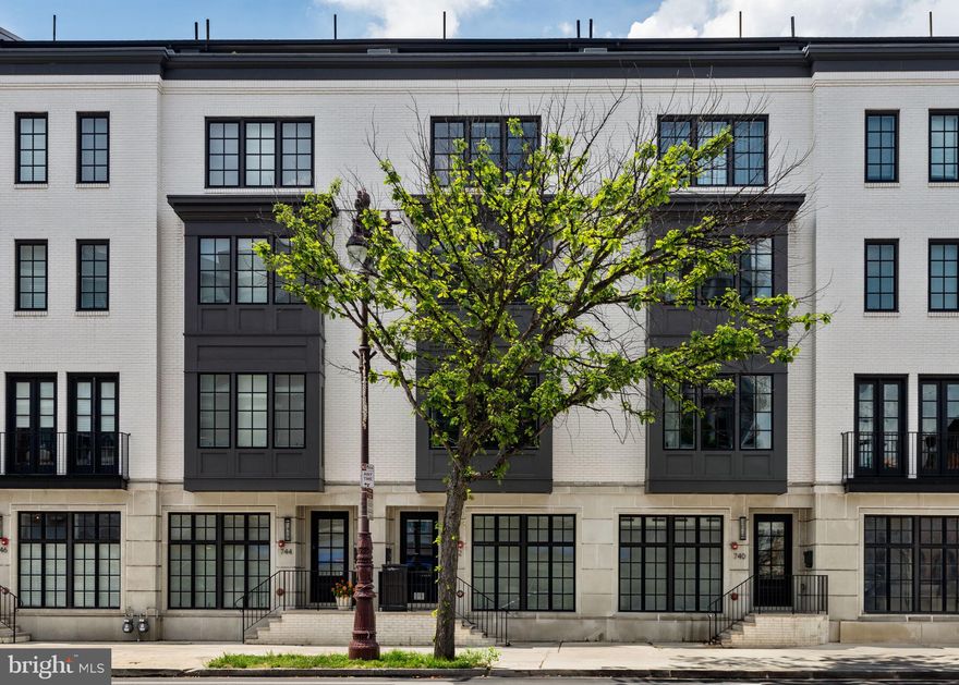 YES, there is peace and privacy on Broad St, soon to be experienced as the  Champs-Élysées of Philadelphia at the completion of the $150 million green space beautification currently underway. Set along the iconic Avenue of the Arts in Philadelphia’s Graduate Hospital neighborhood, the ten home collection at Lydian Place are a rare blend of elegance, modernity, and intelligent urban design. Designed by regarded Asher, Staugnwhite + Partners, the home spans over 4,000 square feet across six expansive levels connected by a private six-stop elevator, including direct access from inside the garage to easily move groceries from the car to the kitchen with the push of a button, and offers both refined living and long-term value in one of the city's most dynamic corridors. The residence welcomes with soaring ceilings, rich natural light, and a clean, modern aesthetic that allows every detail to speak. The second floor main level flows seamlessly from a generous living area anchored by a sleek gas fireplace to a dining space and custom kitchen with exceptional appliances by Bosch, Wolf and Sub-Zero—crafted for the way we entertain now, with form and function perfectly in balance. A full-floor primary suite provides a true sanctuary, complete with two walk-in owners’ closets and a spa-inspired bath featuring a freestanding soaking tub, dual vanities, walk-in shower, water closet, and calming finishes throughout. Additional bedrooms are thoughtfully designed for comfort and privacy, offering ideal accommodations for family or guests. The fully finished basement level offers remarkable versatility. It can be outfitted as a private guest suite with a bedroom, full bath, and living area—or reimagined as a wellness floor with space for a home gym, yoga studio, and separate bath. The possibilities are as limitless as the layout is functional. Atop it all, a generous pilot house leads to two expansive roof decks with sweeping views of the Philadelphia skyline—an extraordinary outdoor living experience in the heart of the city. What makes this home especially compelling is its unique position as both a lifestyle and investment opportunity. With approximately six years remaining on the property tax abatement, owners enjoy significant long-term savings, while the home’s size, design, and location make it extremely attractive to discerning renters—should one ever wish to lease it. Located in one of Philadelphia’s most walkable and transit-accessible areas, the property boasts a Walk Score of 97 and a Rider's Score of 99. World-class dining, theater, museums, parks, boutiques, and the cultural heartbeat of the city are just steps away. More than a home, this is a lifestyle offering for the design-conscious, arts-loving city dweller who wants to live with intention—someone who values both the pleasures of home and the vibrancy of urban life just beyond their door. Whether as a primary residence or a long-term investment in one of Philadelphia’s most desirable neighborhoods, this property delivers exceptional value, architectural distinction, and a way of living that’s anything but ordinary. Additional long term parking available at several nearby garages; street parking is always easy to find!