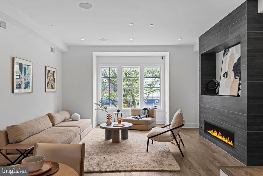 Set along the iconic Avenue of the Arts in Philadelphia’s Graduate Hospital neighborhood, the ten home collection at Lydian Place are a rare blend of elegance, modernity, and intelligent urban design. Designed by regarded Asher, Staugnwhite + Partners, the home spans over 4,000 square feet across six expansive levels connected by a private six-stop elevator, including direct access from inside the garage to easily move groceries from the car to the kitchen with the push of a button, and offers both refined living and long-term value in one of the city's most dynamic corridors. The residence welcomes with soaring ceilings, rich natural light, and a clean, modern aesthetic that allows every detail to speak. The second floor main level flows seamlessly from a generous living area anchored by a sleek gas fireplace to a dining space and custom kitchen with exceptional appliances by Bosch, Wolf and Sub-Zero—crafted for the way we entertain now, with form and function perfectly in balance. A full-floor primary suite provides a true sanctuary, complete with two walk-in owners’ closets and a spa-inspired bath featuring a freestanding soaking tub, dual vanities, walk-in shower, water closet, and calming finishes throughout. Additional bedrooms are thoughtfully designed for comfort and privacy, offering ideal accommodations for family or guests. The fully finished basement level offers remarkable versatility. It can be outfitted as a private guest suite with a bedroom, full bath, and living area—or reimagined as a wellness floor with space for a home gym, yoga studio, and separate bath. The possibilities are as limitless as the layout is functional. Atop it all, a generous pilot house leads to two expansive roof decks with sweeping views of the Philadelphia skyline—an extraordinary outdoor living experience in the heart of the city. What makes this home especially compelling is its unique position as both a lifestyle and investment opportunity. With approximately six years remaining on the property tax abatement, owners enjoy significant long-term savings, while the home’s size, design, and location make it extremely attractive to discerning renters—should one ever wish to lease it. Located in one of Philadelphia’s most walkable and transit-accessible areas, the property boasts a Walk Score of 97 and a Rider's Score of 99. World-class dining, theater, museums, parks, boutiques, and the cultural heartbeat of the city are just steps away. More than a home, this is a lifestyle offering for the design-conscious, arts-loving city dweller who wants to live with intention—someone who values both the pleasures of home and the vibrancy of urban life just beyond their door. Whether as a primary residence or a long-term investment in one of Philadelphia’s most desirable neighborhoods, this property delivers exceptional value, architectural distinction, and a way of living that’s anything but ordinary. Additional long term parking available at several nearby garages; street parking is always easy to find!