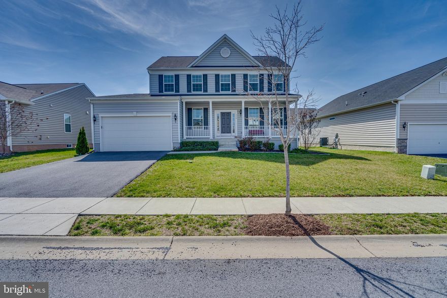 Step into luxury living with this immaculate 4-bedroom, 3.5-bath Colonial-style home. The first floor boasts a seamless blend of formal living and dining rooms, an upgraded kitchen featuring granite counters, an island, stainless steel appliances, a pantry, and a generously-sized family room. The kitchen and family room showcase elegant plantation shutters/blinds, adding a touch of sophistication. The second floor hosts a charming primary suite with a private bath and a walk-in closet, alongside three other spacious bedrooms and a full bath. The partially finished lower level features a  rec room, a possible gym or home office, complemented by a utility room. Outside, a large composite deck with a white vinyl railing beckons for outdoor gatherings. With a 2-car garage and convenient proximity to commuter routes, this residence epitomizes both style and functionality.