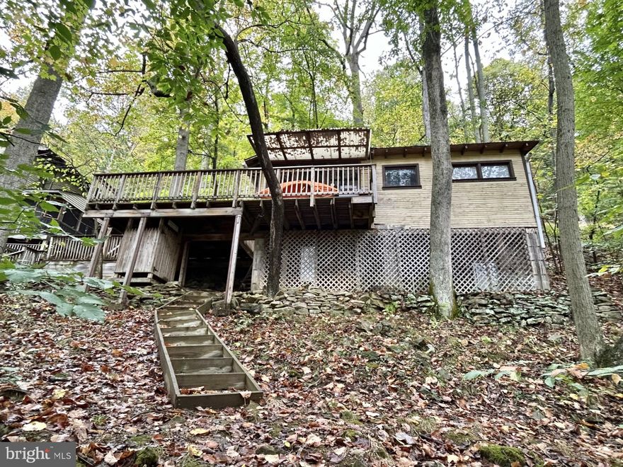 Ever dreamed of owning your own getaway on Yough Lake with your own personal boat dock and boat slip? (a very rare find in the area) - permit conveys as well.  Here is your chance!! Secluded seasonal cabin which sits right on Yough Lake. Amazing relaxing oasis. Yet, not far from the hiking/biking trail, several fishing streams/rivers. Just a few miles from Ohiopyle, Nemacolin Resort, Seven Springs and Hidden Valley resorts. Not far from several golf courses, short drive to Deep Creek Lake area. The best of both worlds awaits!