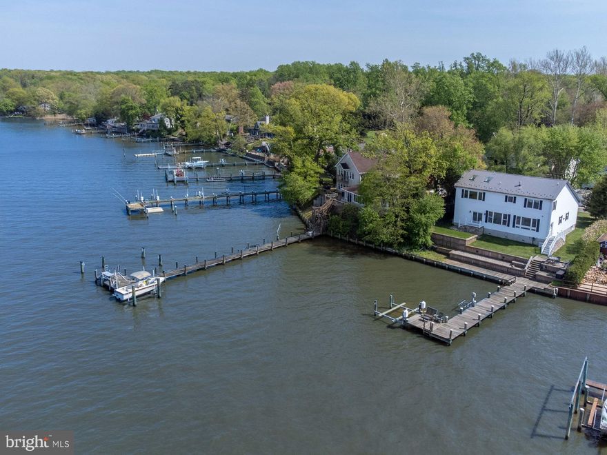 Nestled along the picturesque Elk River, 37 Blair Ln. offers a luxurious retreat for those seeking waterfront living at its finest. This stunning property, completed in 2018, boasts over 3,400 +/- square feet of meticulously crafted living space, thoughtfully designed for both comfort and style. Step inside to discover custom cherry cabinets, a gas fireplace, and custom lighting throughout, creating an ambiance of comfortable waterfront living. Outside, 88 feet of water frontage beckon, with a 70-foot L shaped dock providing the perfect spot for boating enthusiasts w/ two boatlifts. The studio above the garage offers versatile space for guests or a home office with ample room for storage. With convenient access to nearby marinas, restaurants, and major highways, this property offers a truly unparalleled waterfront lifestyle.